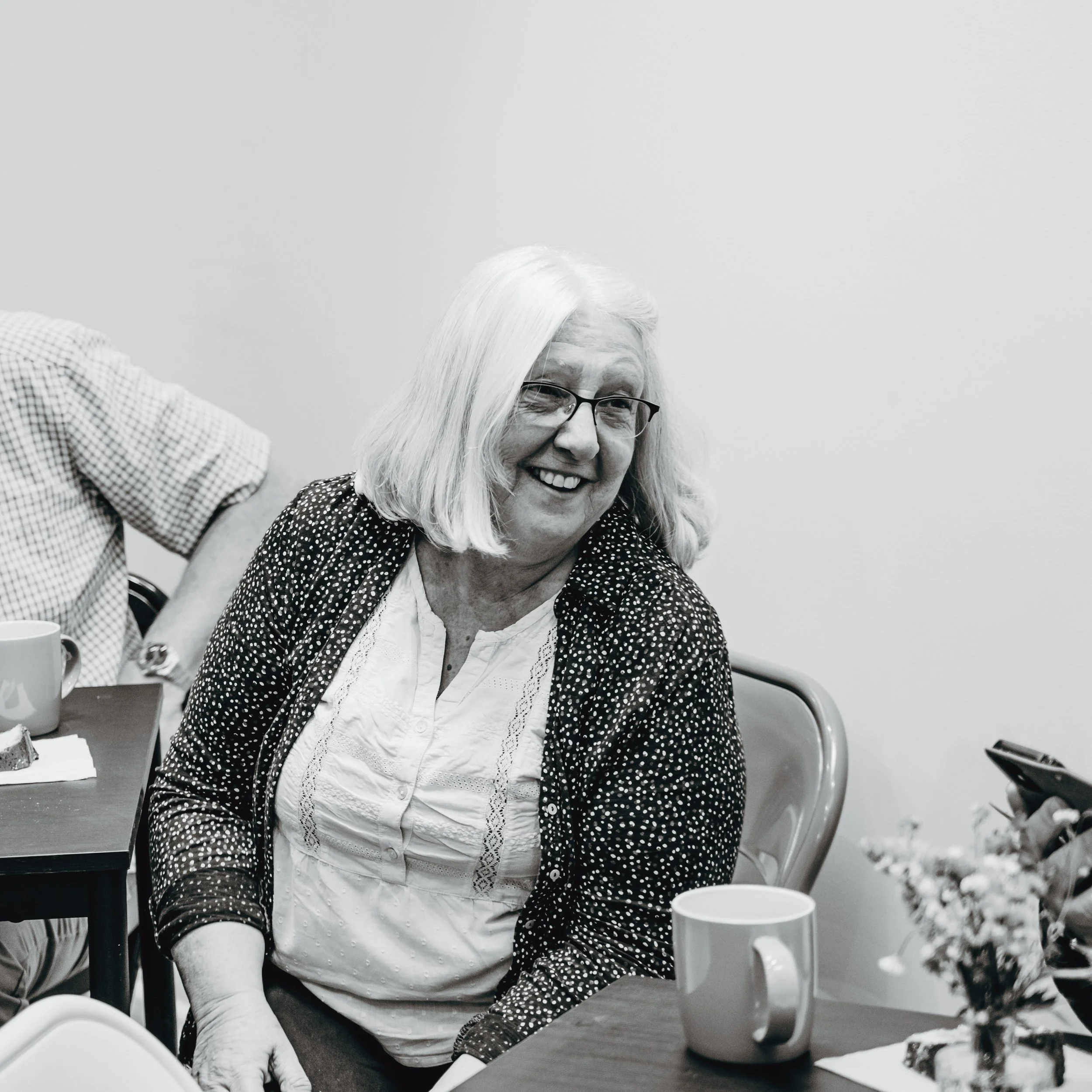 Smiling and chatting over a coffee