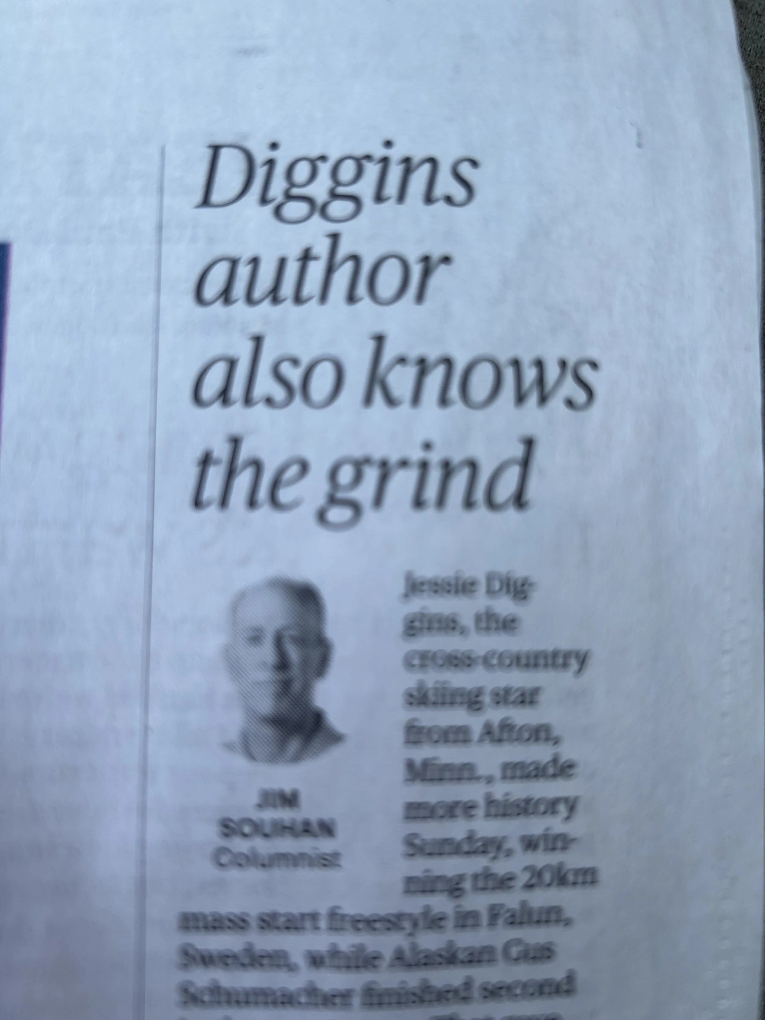 Newspaper clipping with headline 'Diggins author also knows the grind' and a small black-and-white photo of Jessie Diggins. The article is about Jessie Diggins, a cross-country skiing star from Afton, Minnesota, who made history by skiing 20 km frees