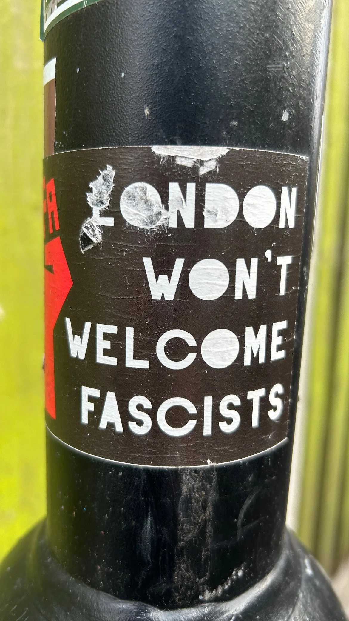 A sticker on a bike frame that says 'London Won't Welcome Fascists'.