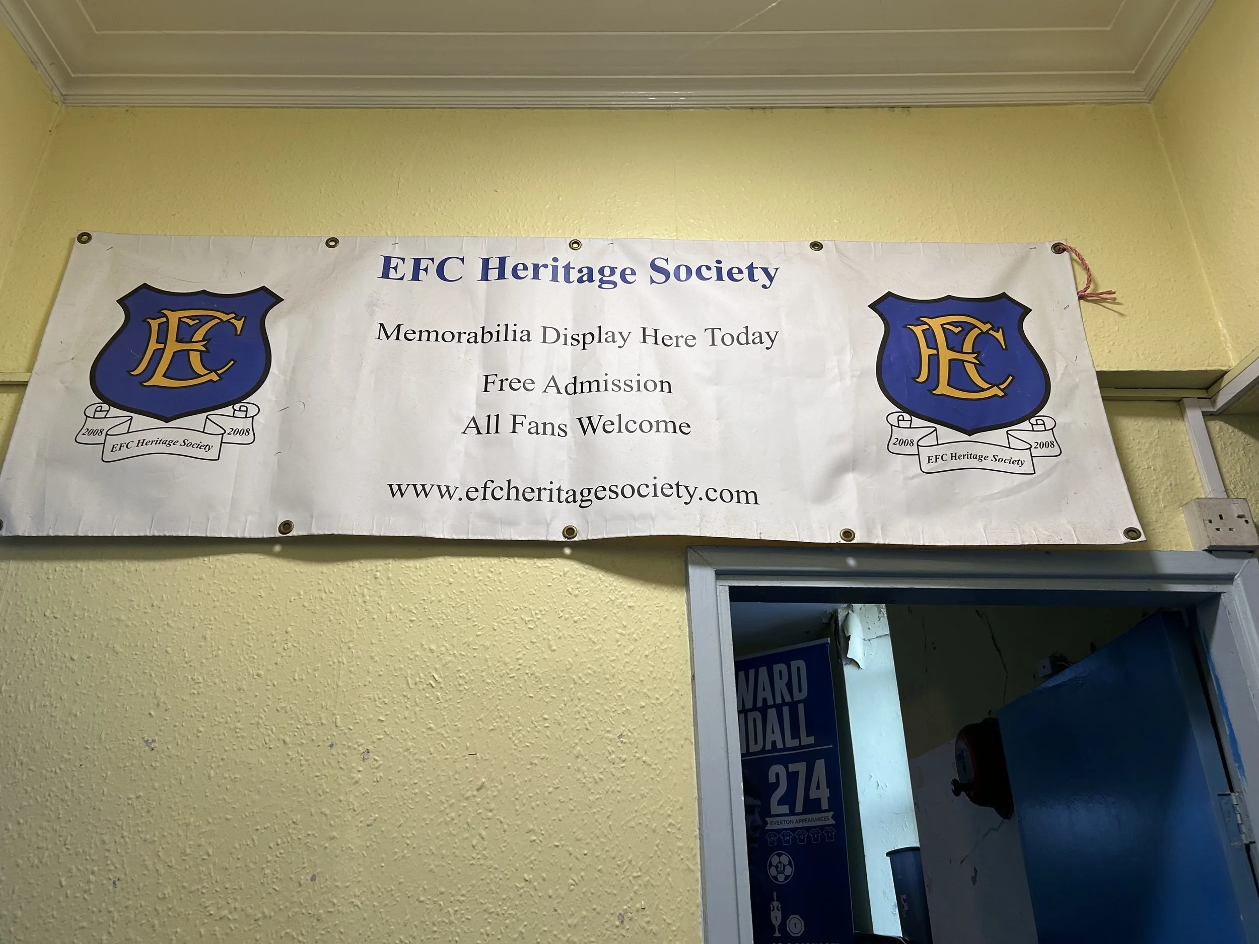 Banner for EFC Heritage Society with logos on either side, announcing memorabilia display, free admission, and welcoming all fans at www.efheritagesociety.com