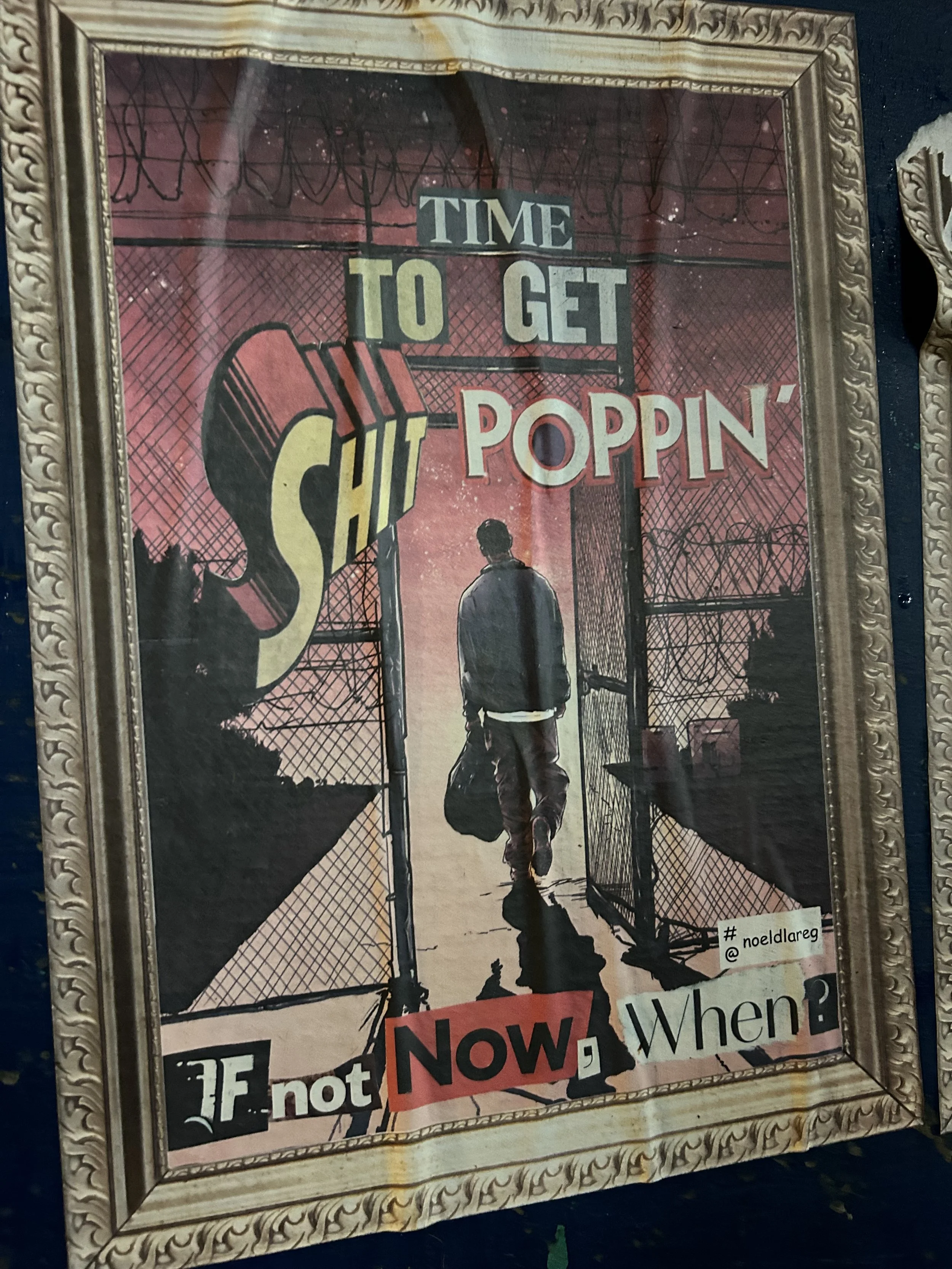 Framed artistic poster with a silhouette of a man walking through a gate, carrying a bag, with urban background. The poster has text: "Time to get sh!t poppin’" and "If not now, when?"