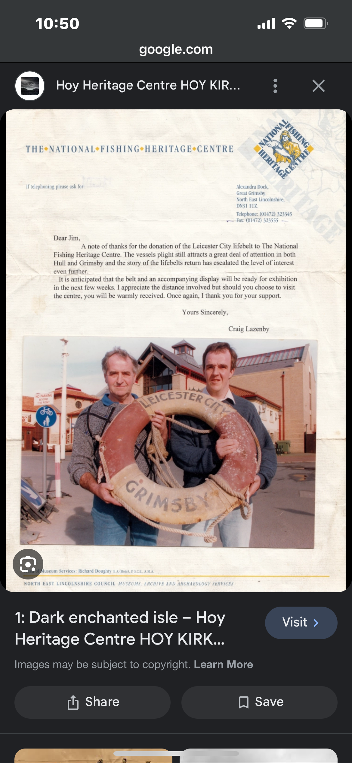 Letter from the National Fishing Heritage Centre with a photo of two men holding a life buoy inscribed with 'Leicester City' and 'Grimsby' in front of a building.
