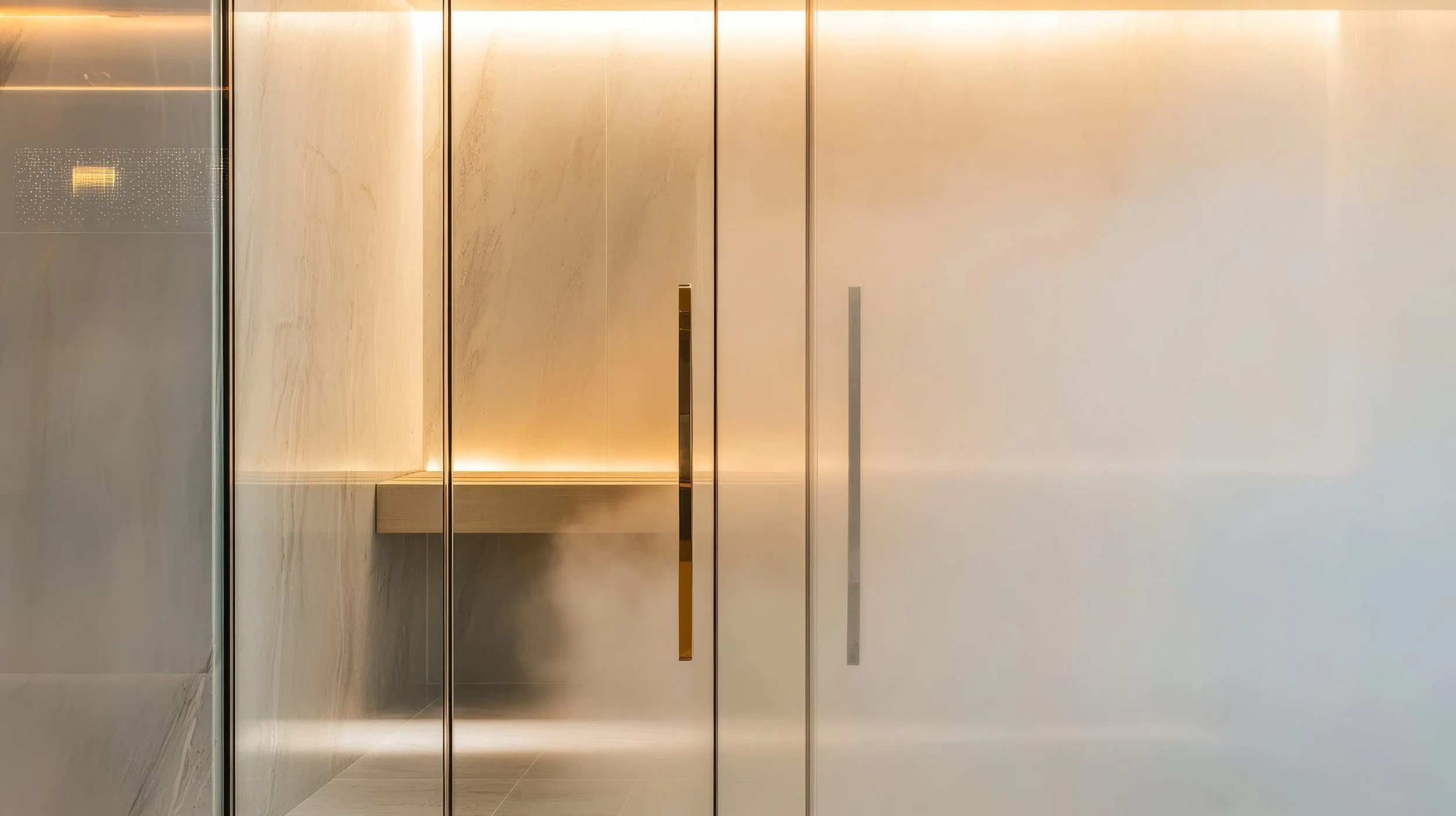 Modern elevator door with a minimalist design, featuring sleek metal panels and integrated handles, illuminated by soft, warm lighting.