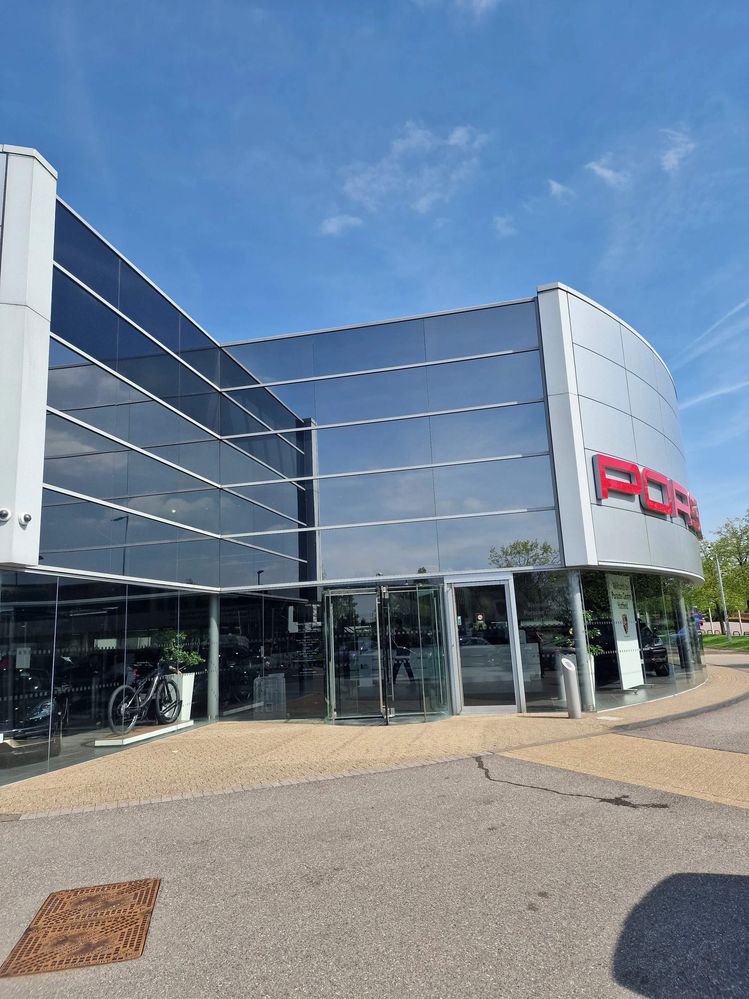 Porsche Centre Portsmouth, UK - Window films applied to  reduce heat gain and glare for the comfort of the staff and customers, as well as UV control.