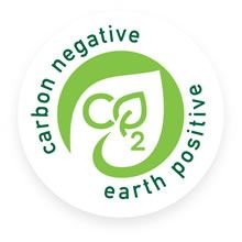 Circular logo with green and white colors, featuring a leaf design and the words 'carbon negative,' 'earth positive' around it.