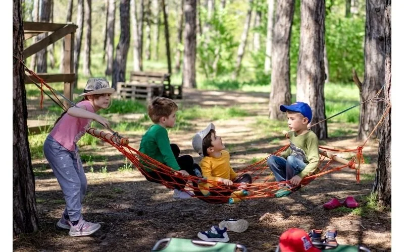 Children participating in a hands-on STEM activity during a group camp program