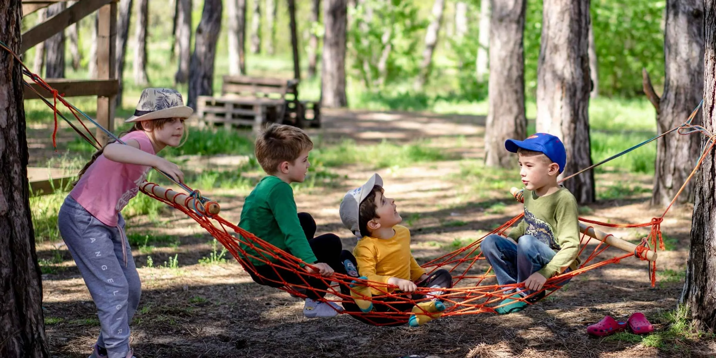 Children participating in outdoor summer camp activities in Michigan, building teamwork and hands-on learning skills