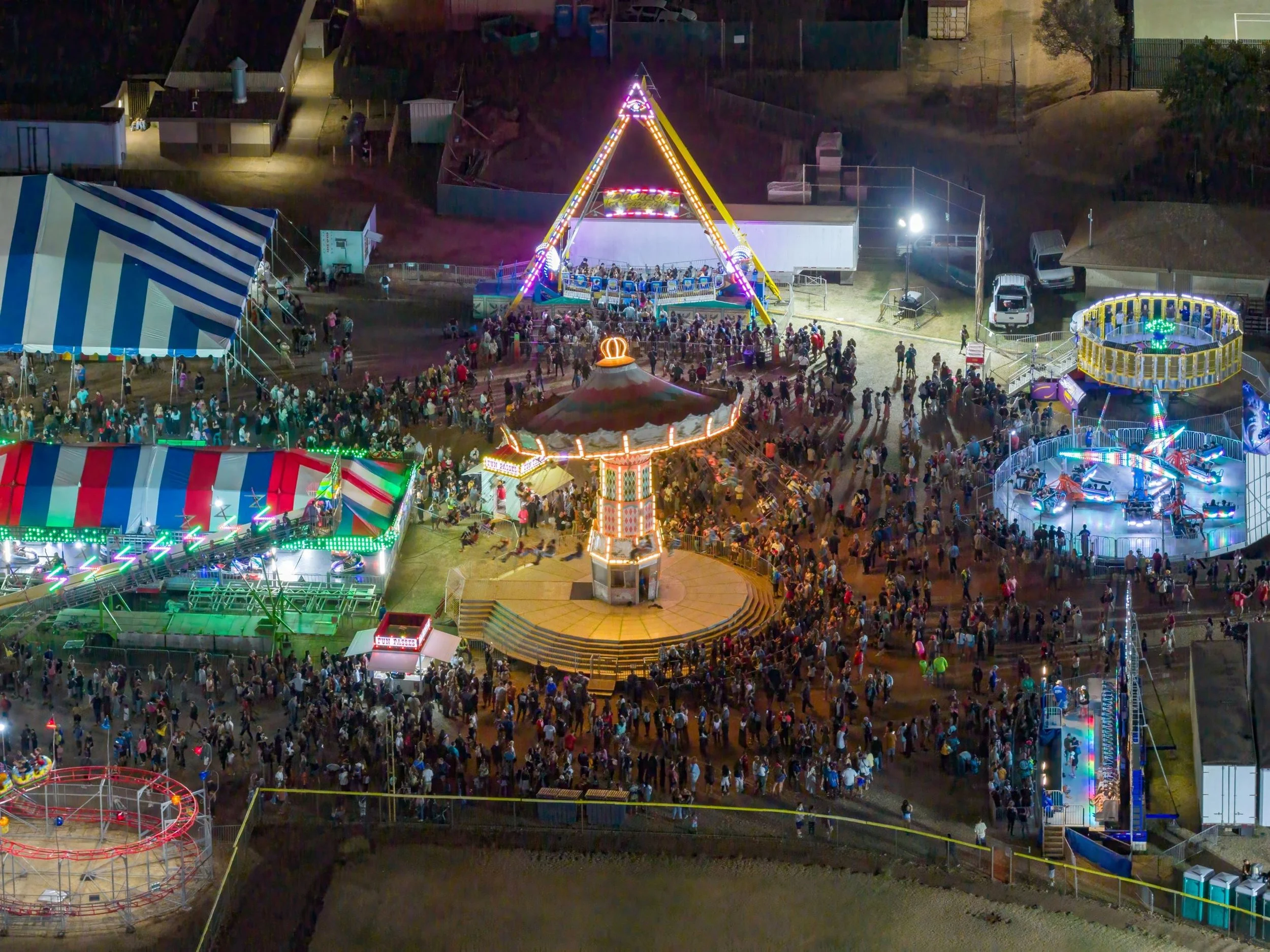 Families enjoying rides and attractions at the Maui County Fair in Wailuku