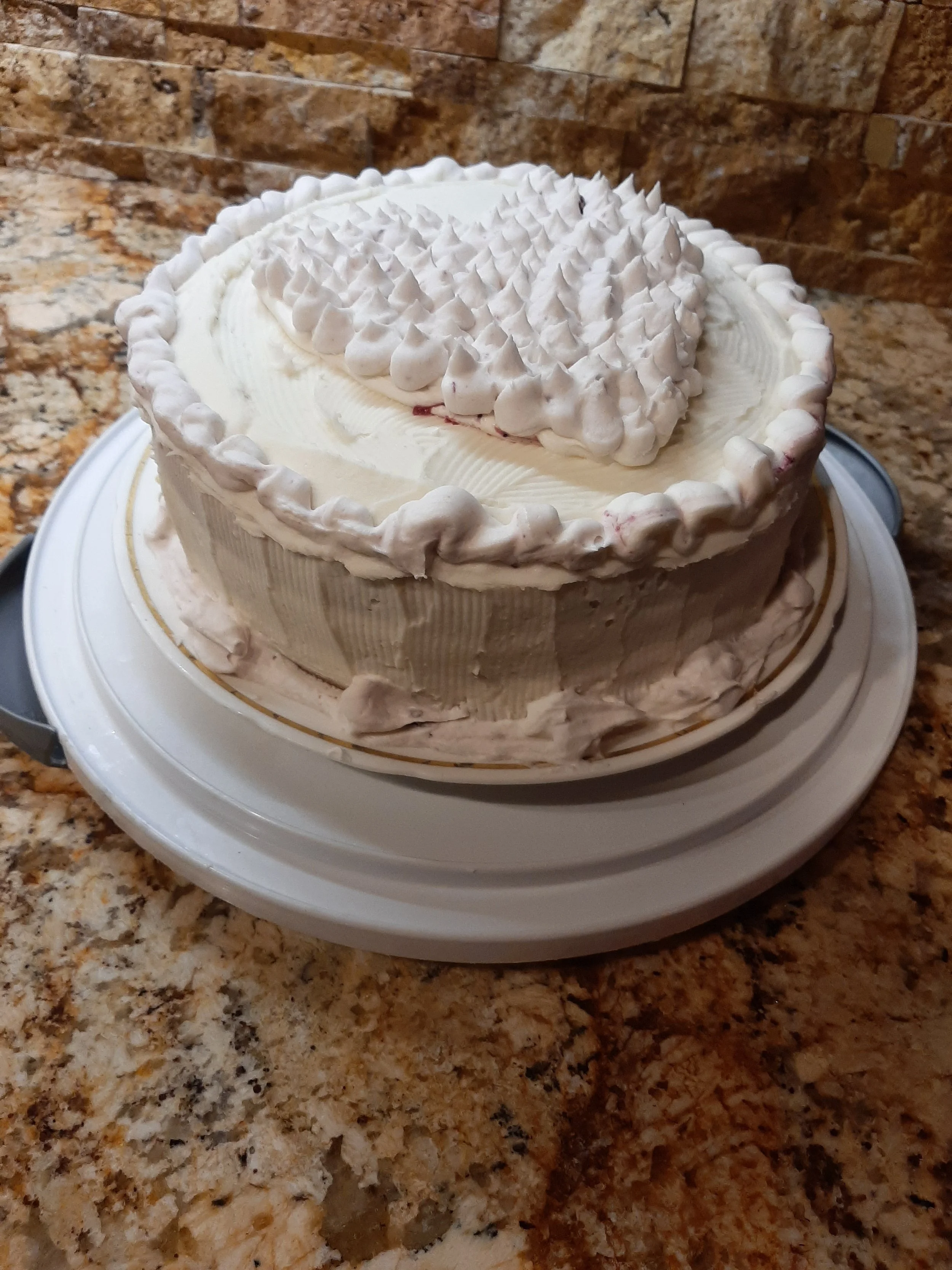 Lemon sponge cake with lemon raspberry filling and raspberry buttercream