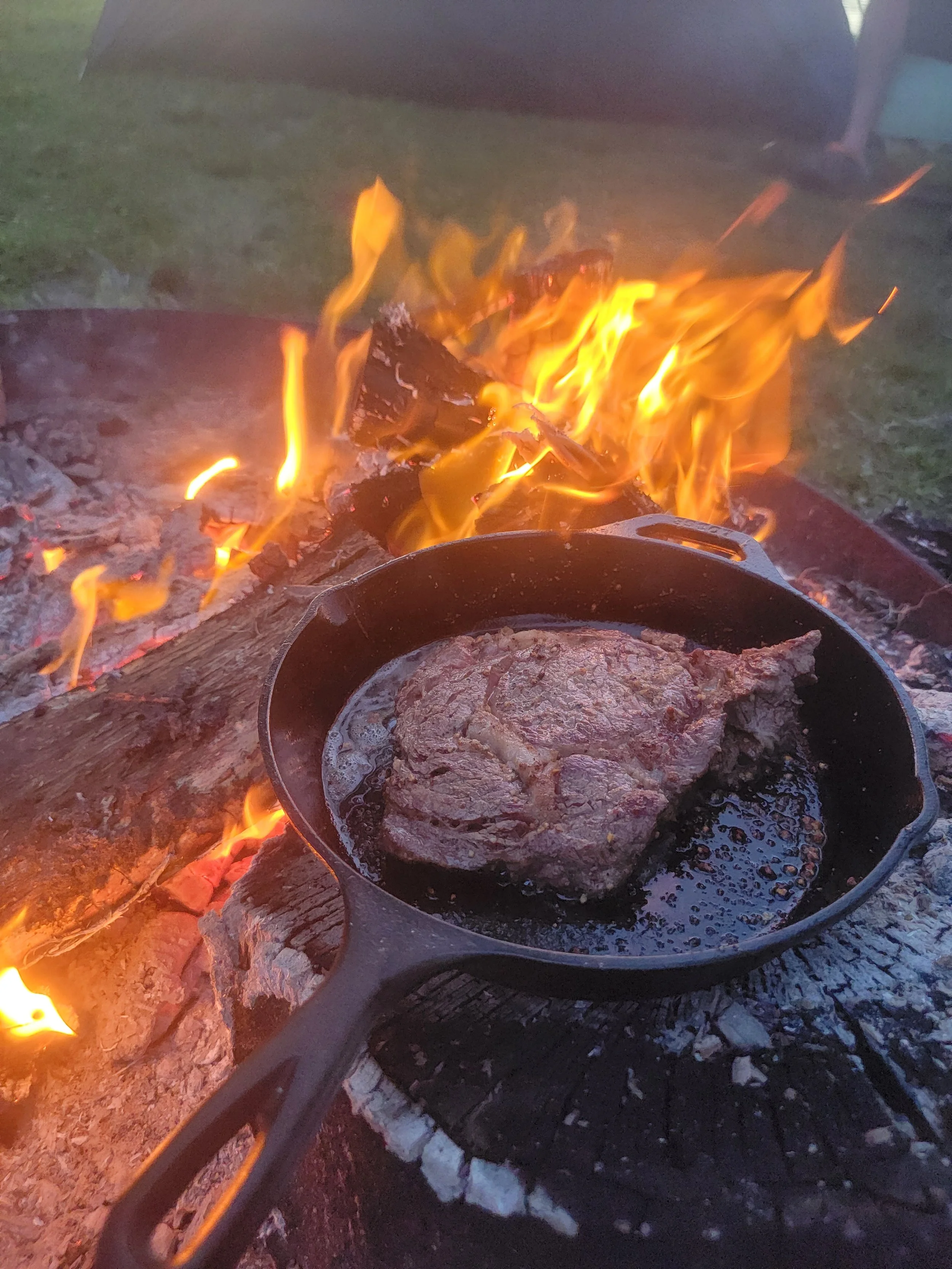Bone in Ribeye seared to perfection over the fire and basted with grass fed butter, garlic, and herbs.