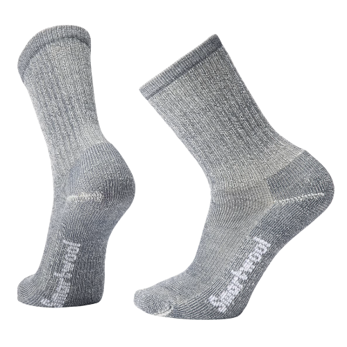 A pair of gray, athletic crew socks with a ribbed texture and branding on the side.
