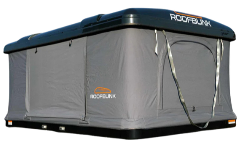 A rooftop tent labeled 'ROOFBUNK' installed on a vehicle, with gray fabric walls and straps hanging down.
