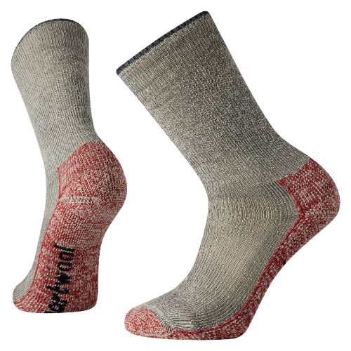 A pair of gray and red athletic socks, one placed upright and the other tilted to the side.