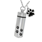 A portable vaporizor with a gray body decorated with black paw prints.