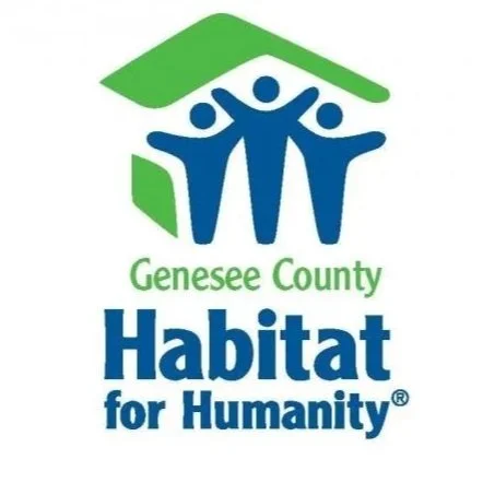 Logo of Genesee County Habitat for Humanity, featuring three blue human figures beneath a green roof and the text 'Genesee County Habitat for Humanity'.