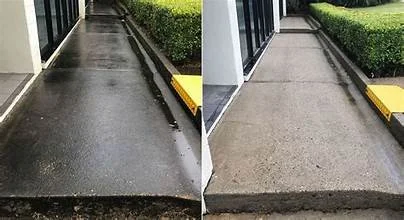 Concrete driveway and sidewalk cleaning services in Duluth Minnesota using commercial-grade heated pressure washing equipment.
