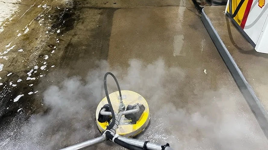 Removing oil, grease, and heavy buildup from concrete surfaces in Duluth MN with high-pressure hot water cleaning.