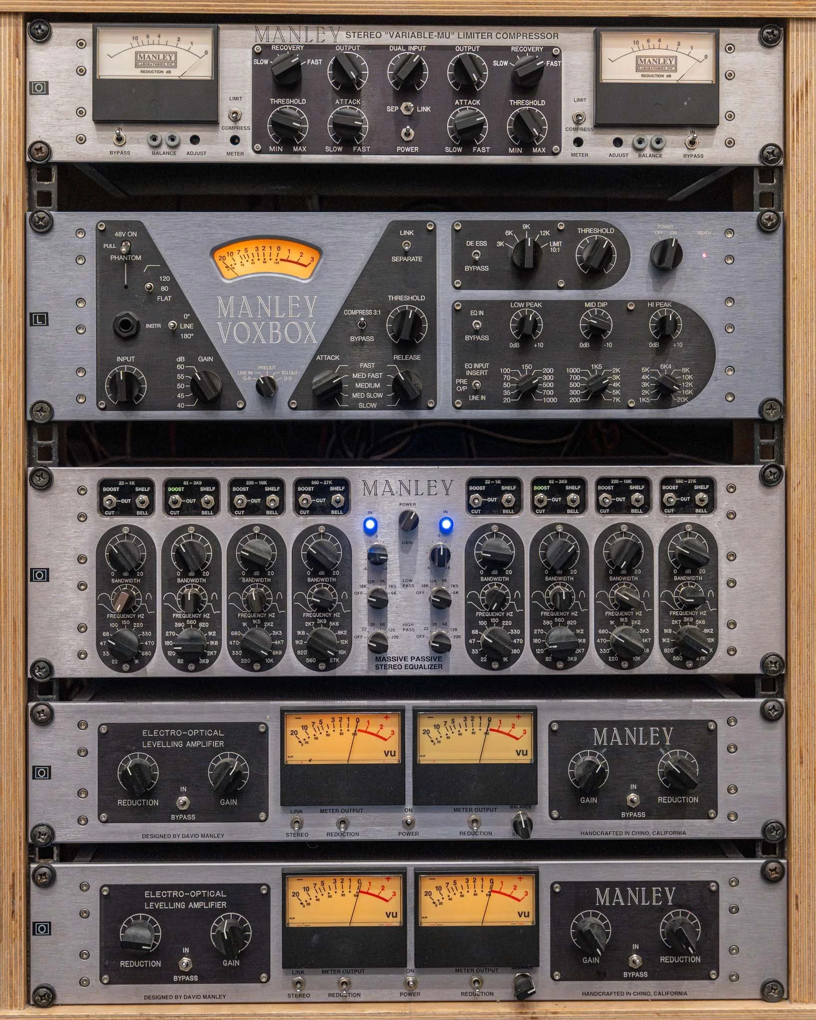 Rack of audio equipment including Manley stereo compressor, Manley VoxBox, Manley stereo equalizer, Manley stereo power amplifiers, and Manley stereo levelling amplifiers.