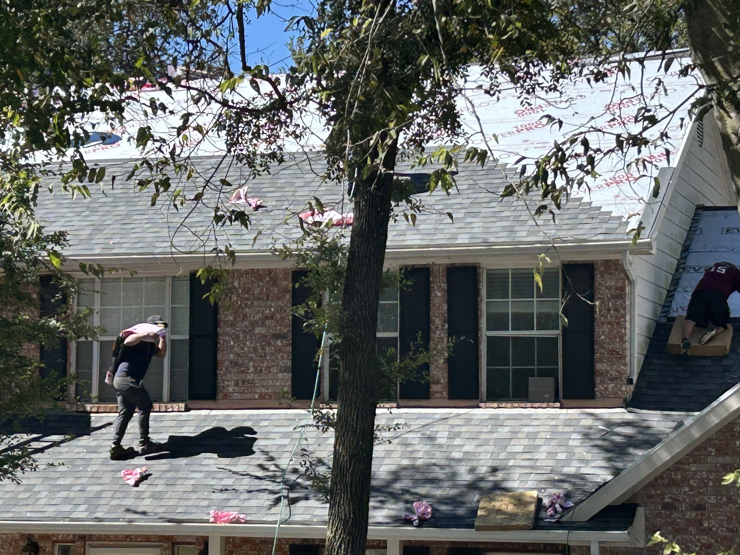 Roofing contractor performing roof repair on a residential property in Fort Worth, Texas.