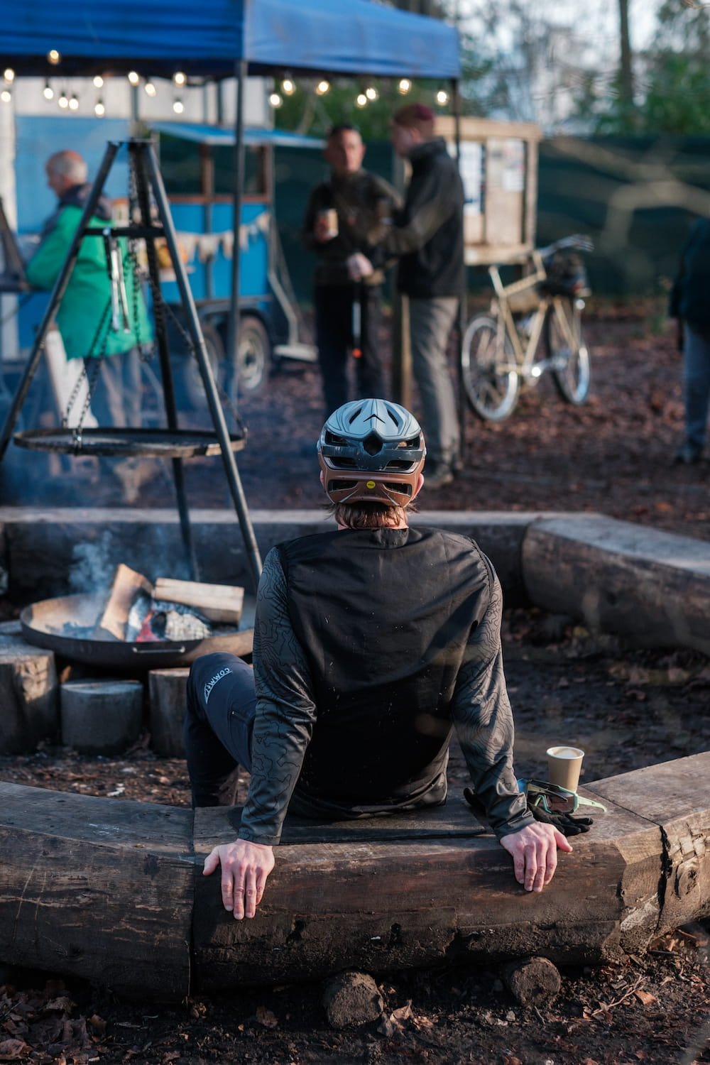 Cyclist enjoying a coffee stop around the fire pit in the Surrey Hills. 