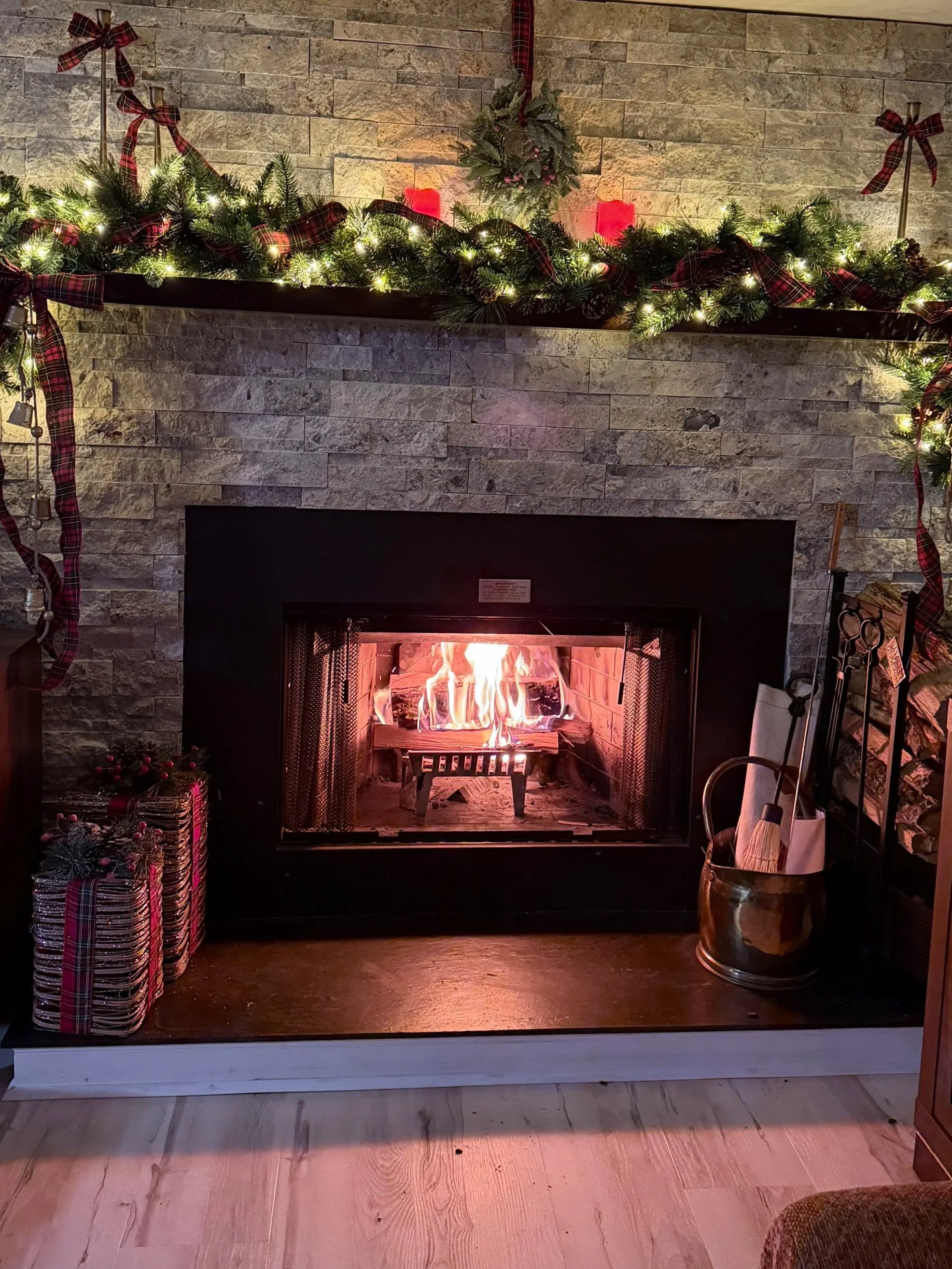 Cozy living room with fireplace at Three Ridges 05, a modern mountain condo at Wintergreen Resort.