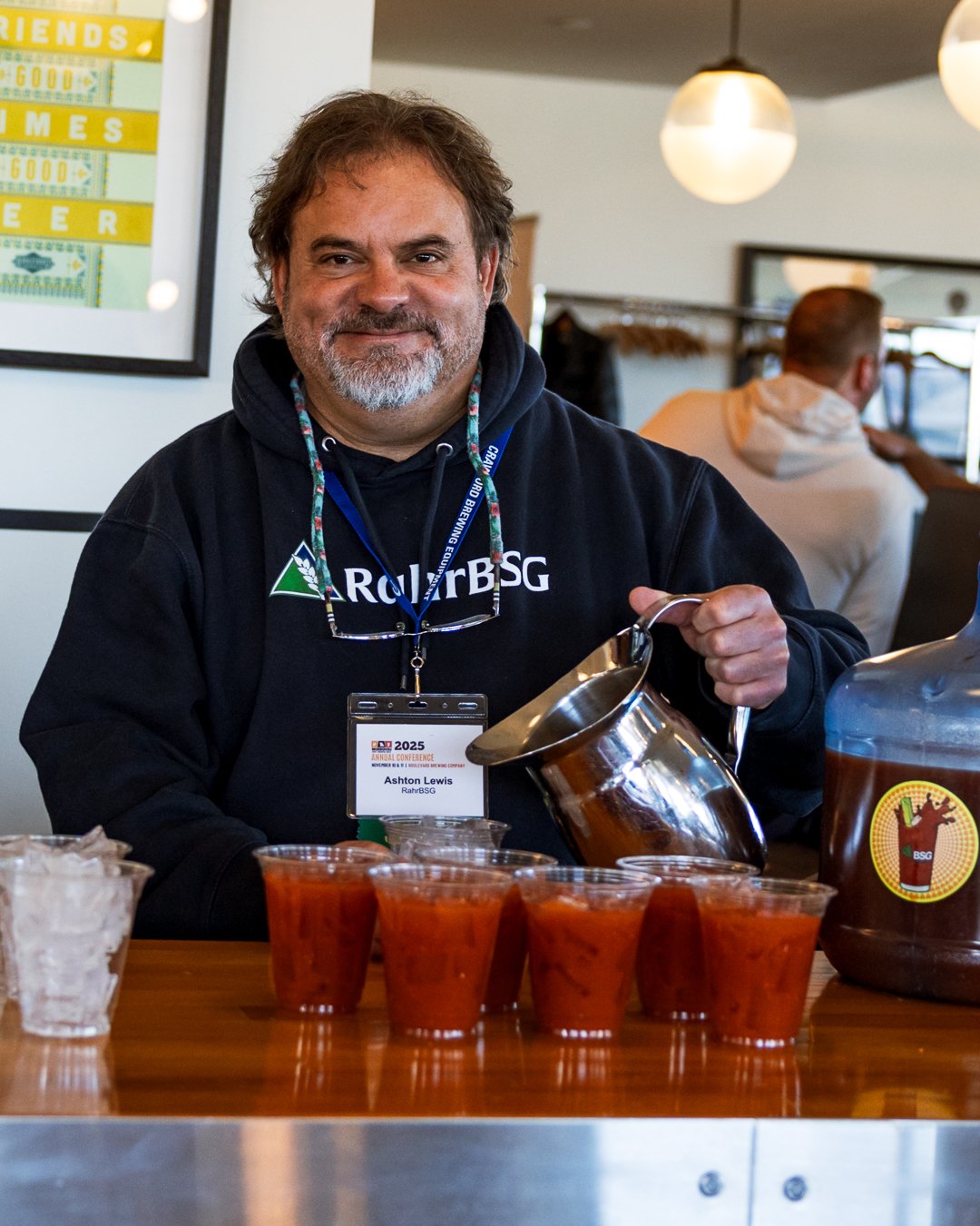 ashton lewis with rahrbsg pours bloody mary's at the conference