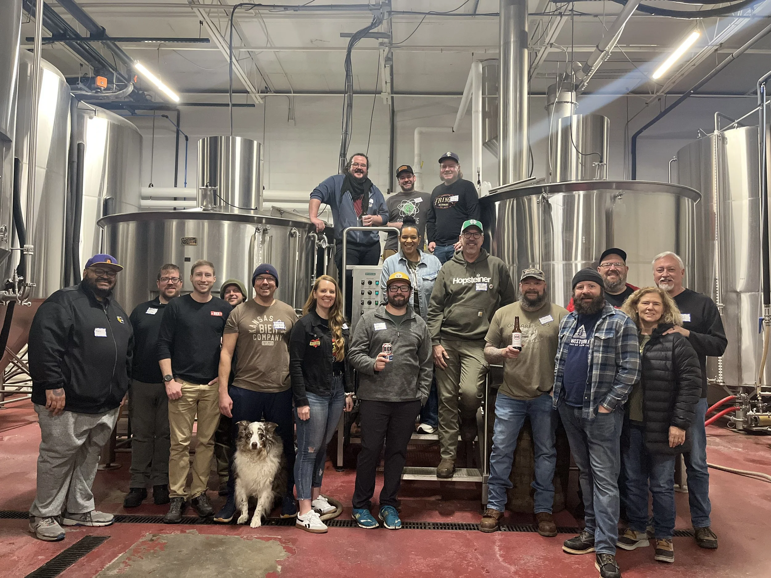 Group of peole posed on the brewing deck at Kansas City Bier Co.