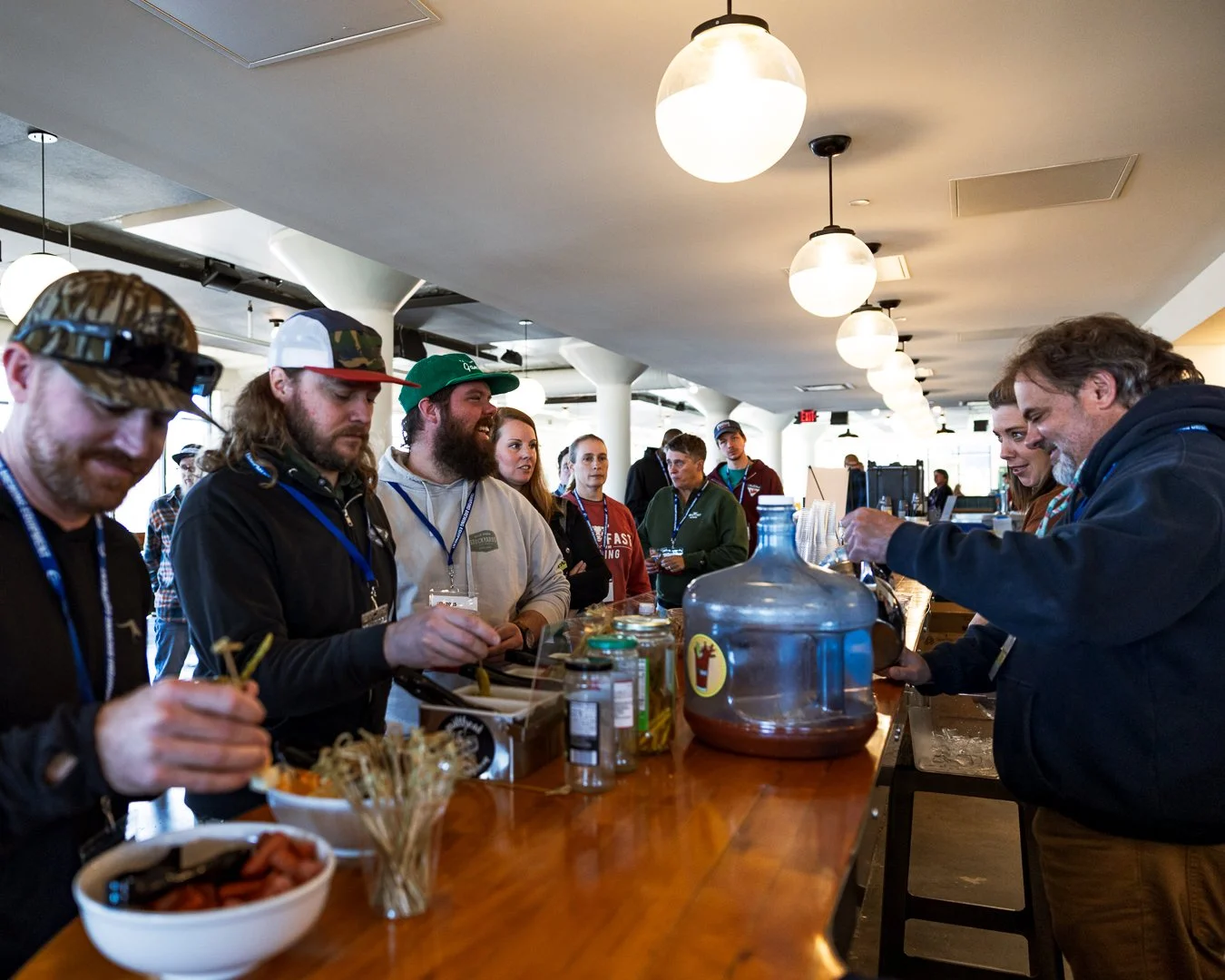 a line of conference attendees at the bloody mary bar