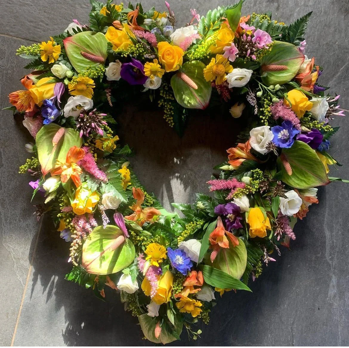Tropical  open heart wreath wigan funeral/farewell flowers - sustainable bio degradable