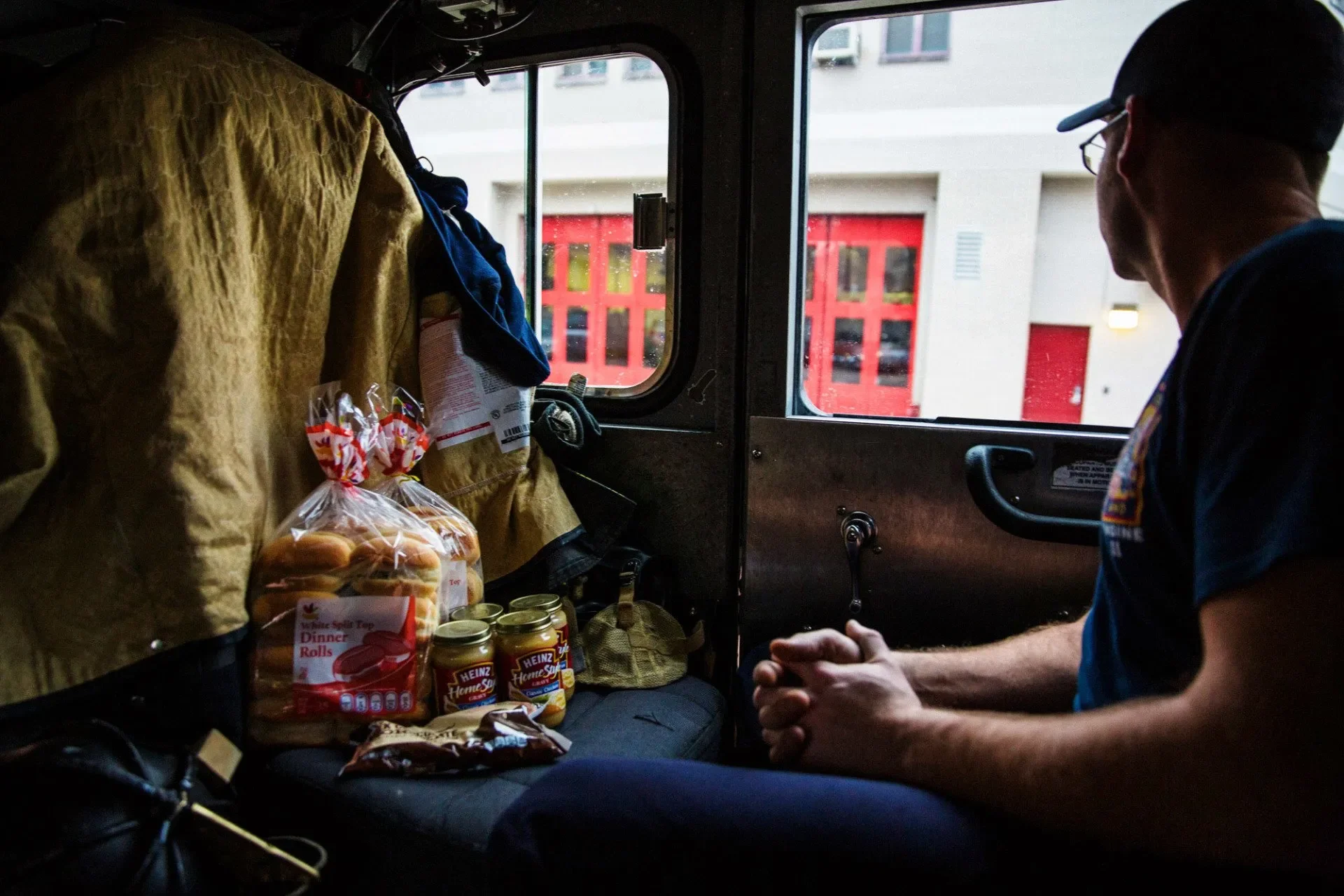 Groceries for the day's dinner rest on a seat in the fire truck after a last minute grocery run. Photograph by Erica Baker