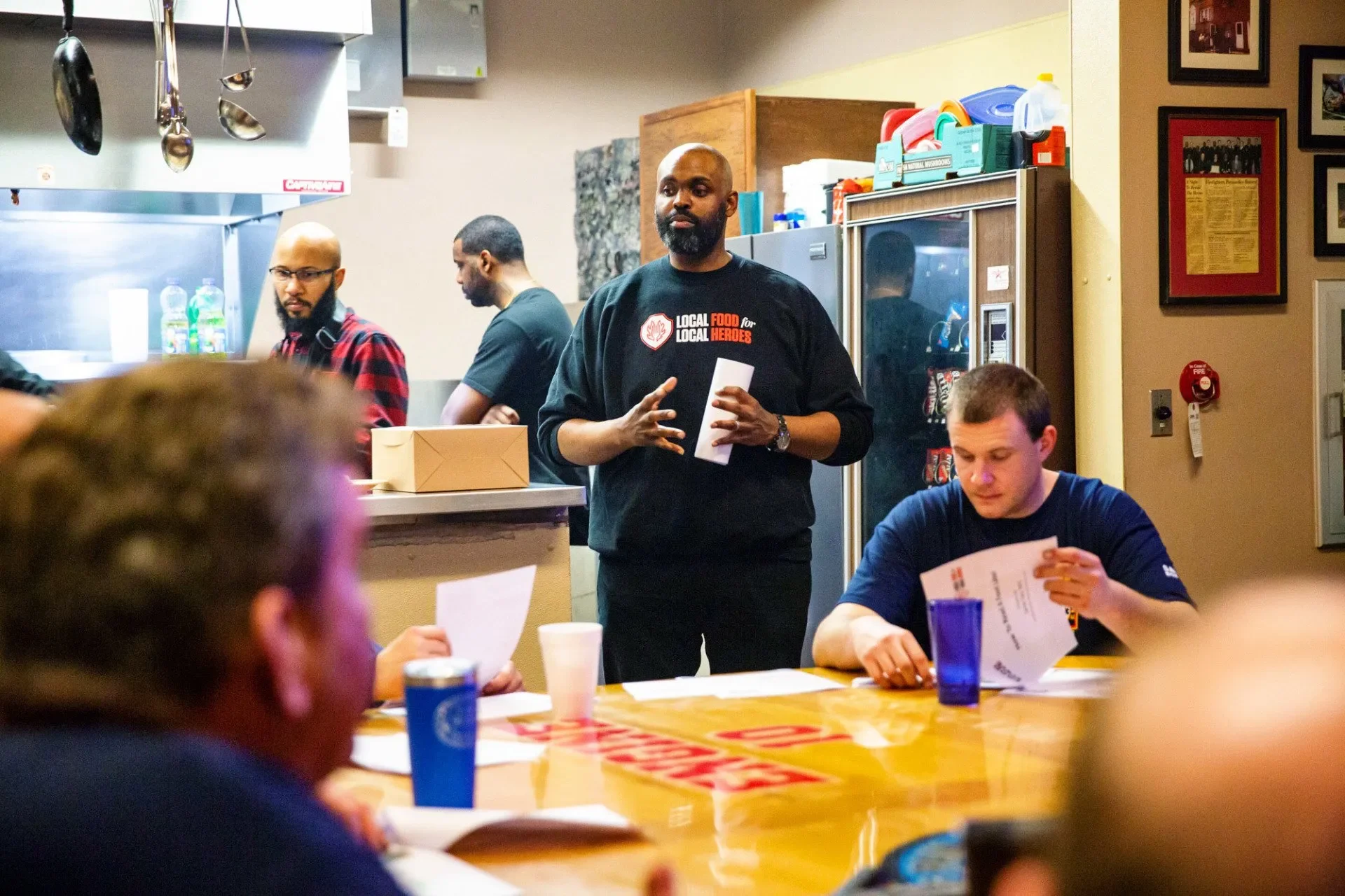 Nutritionist James Tate teaches firefighters about food labels. Photograph by Erica Baker