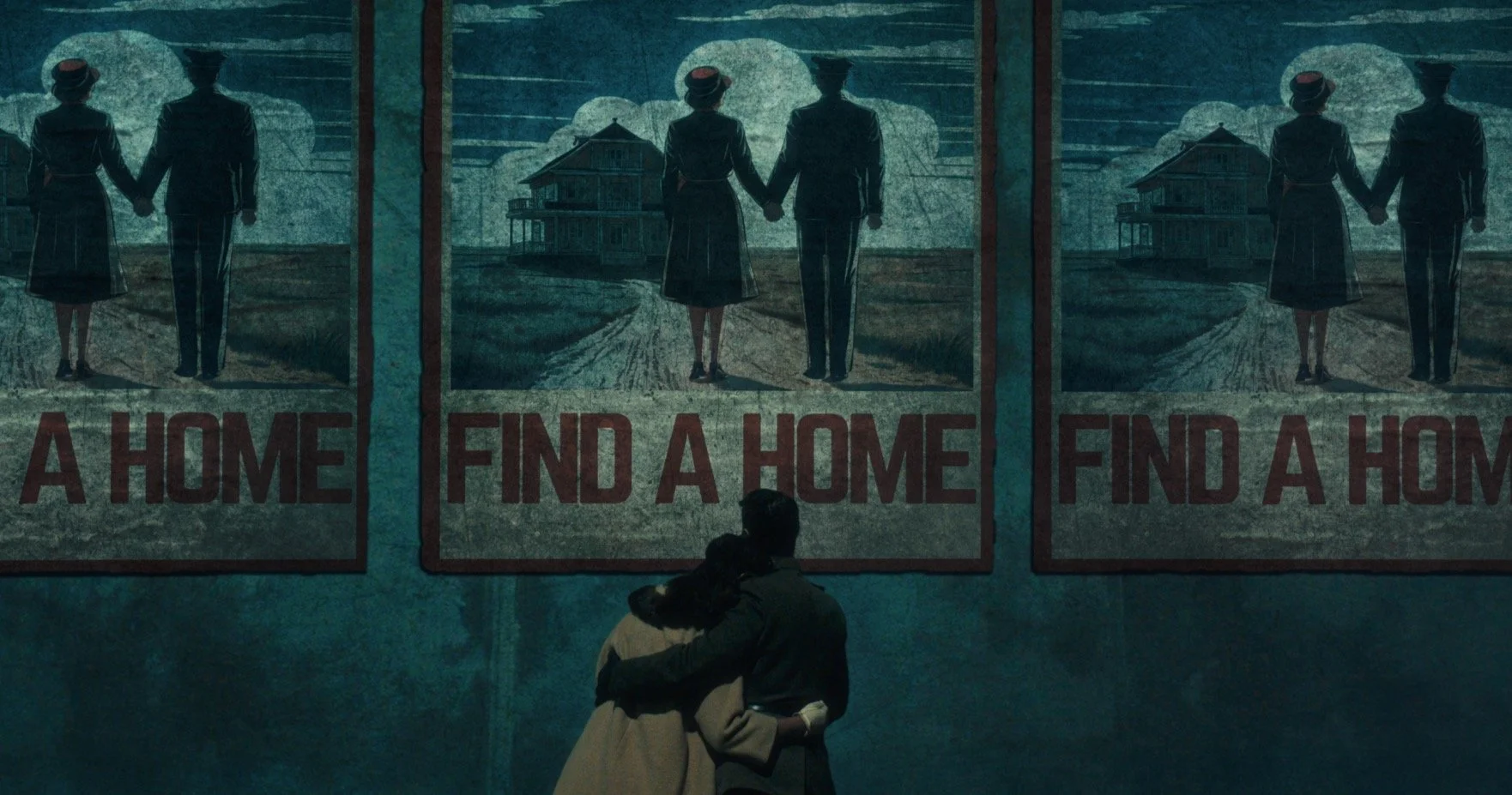 A couple embracing in front of a mural depicting a man and woman holding hands, with the phrase 'A HOME FIND A HOME' repeated below.