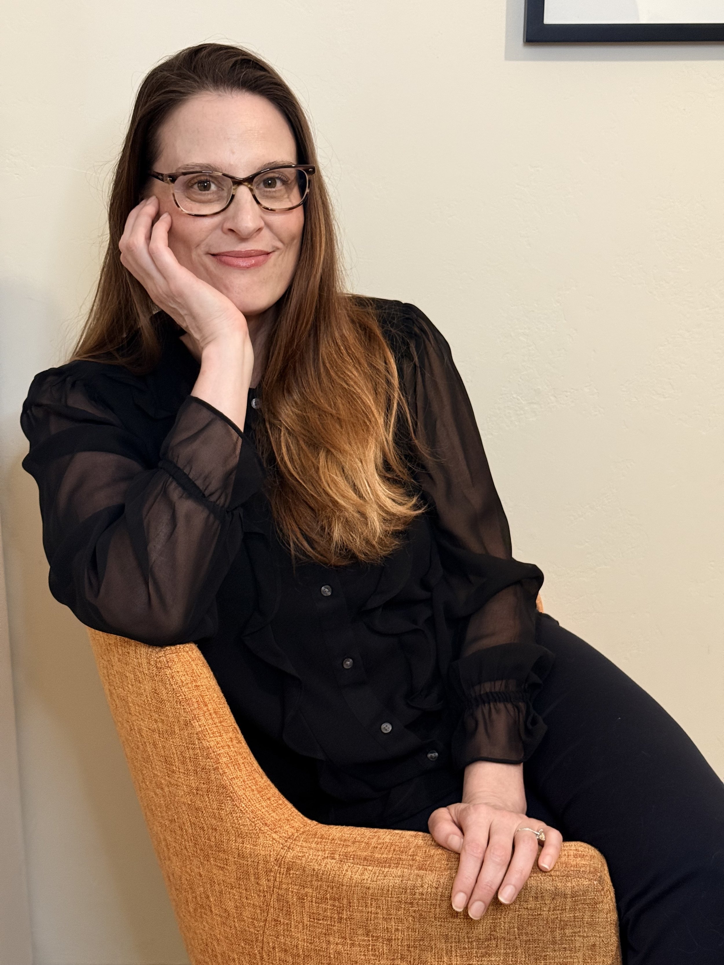 Andrea Hindes, Ph.D., psychologist in Folsom, California sits in chair
