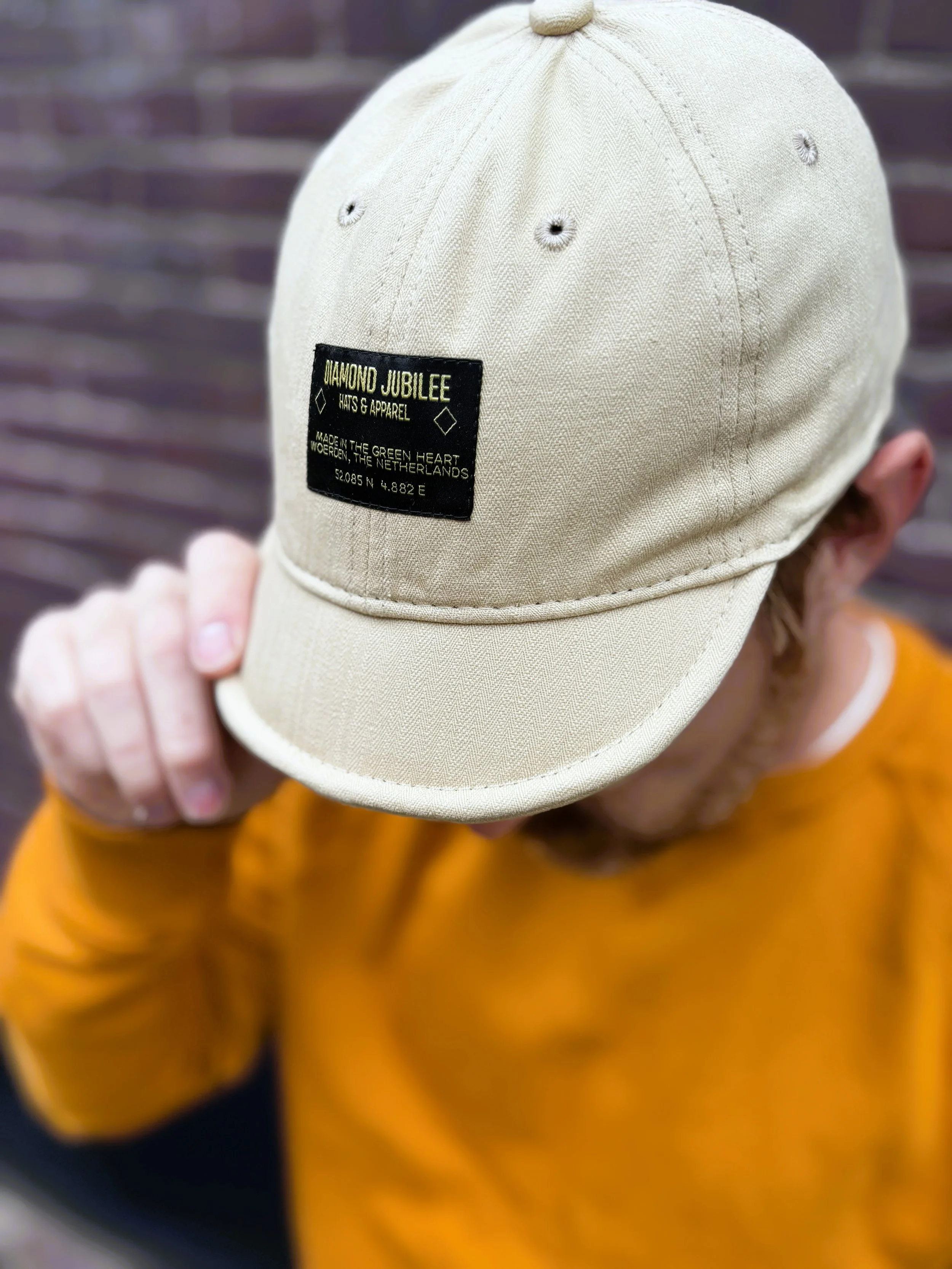 Cream cycle cap on me front.jpg