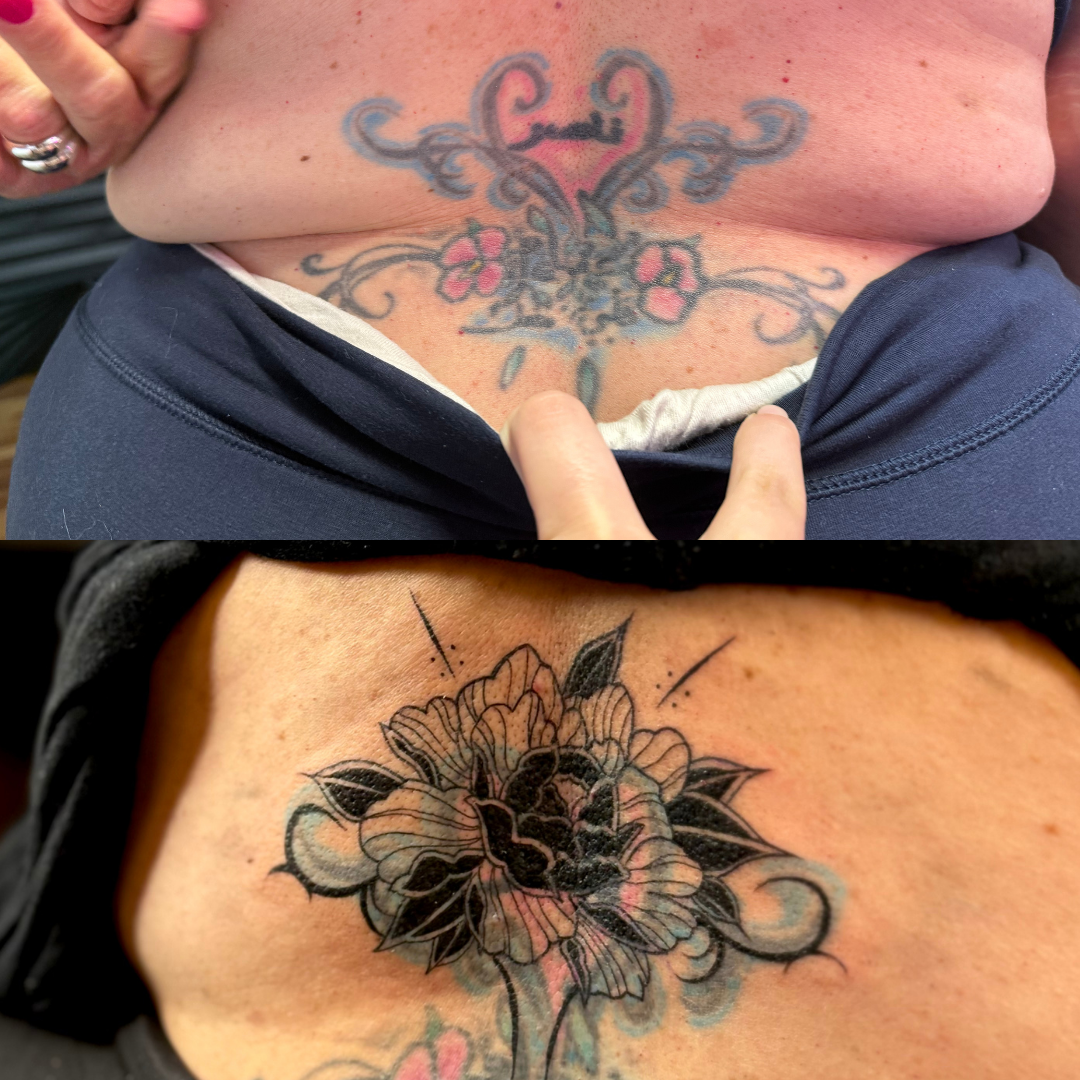 Blackwork floral cover-up tattoo transforming an older lower back tattoo into detailed botanical linework