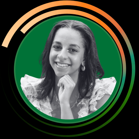 A young woman with long dark hair and earrings, smiling with her hand near her chin, in front of a graphic green and black background with orange accent circles.