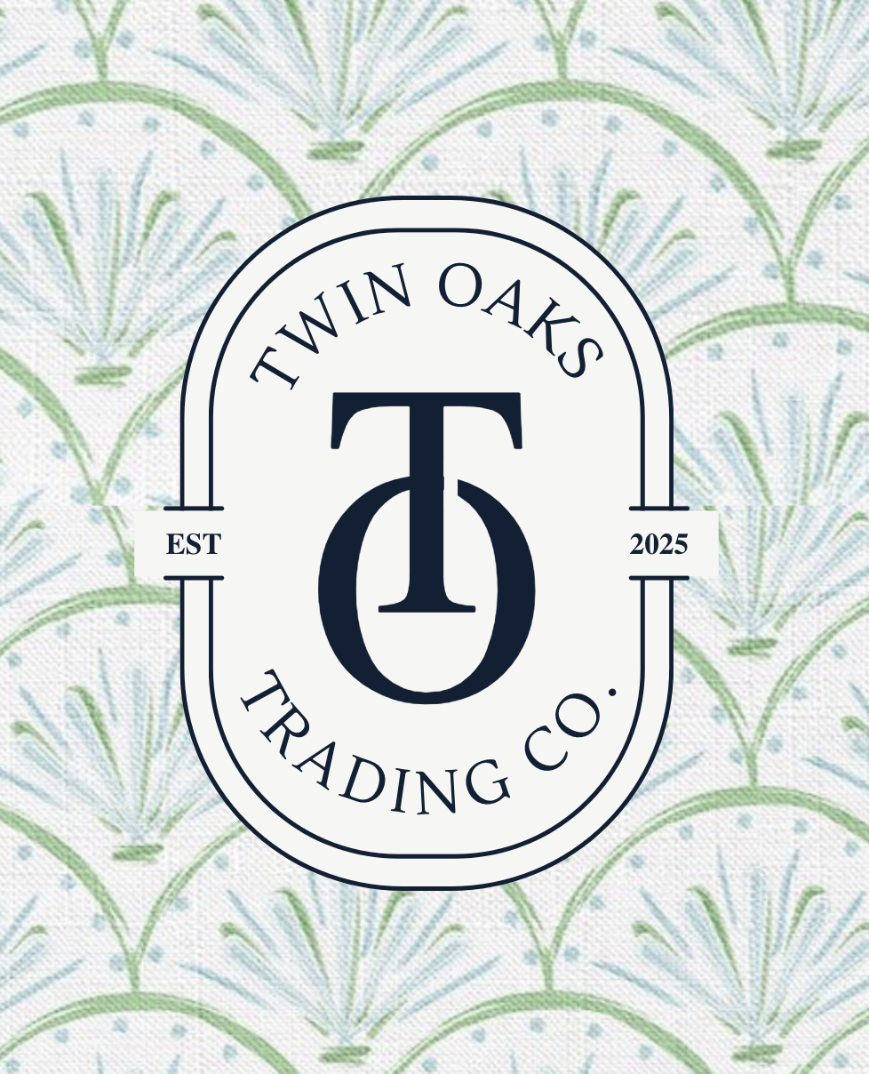 Logo for Twin Oaks Trading Co. with an intertwined T and O, established in 2025, against a patterned background of stylized palm leaves in green and blue.