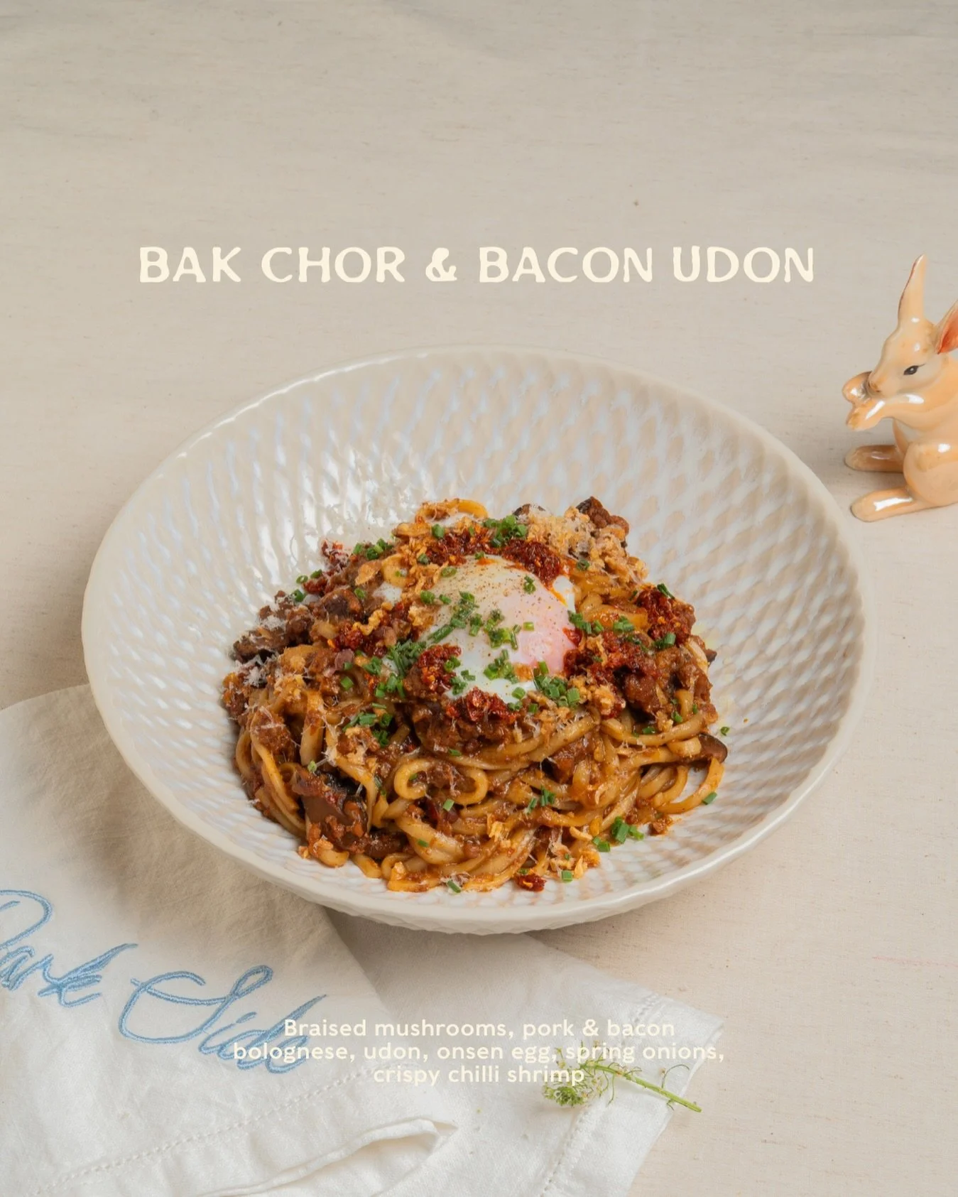 The bowl that brings a little local nostalgia to the Park Side table.

Thick udon tossed in a rich pork and bacon bolognese with braised mushrooms, crowned with a silky onsen egg. 

Finished with spring onions and crispy chilli shrimp, with a bright 