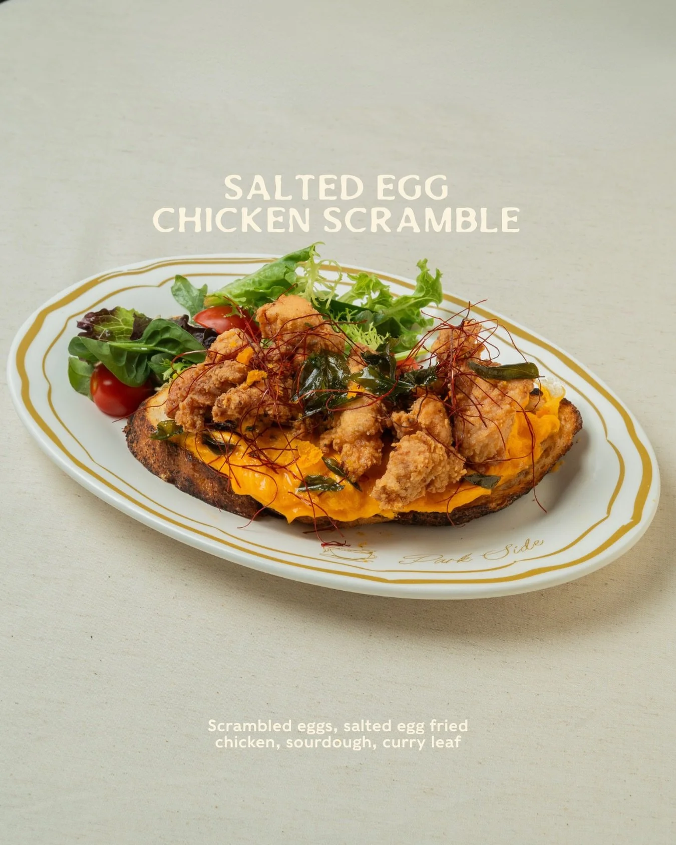 Golden, crisp salted egg fried chicken over soft eggs and toasted sourdough. Curry leaves crackle, with just enough heat to keep things interesting. 💫