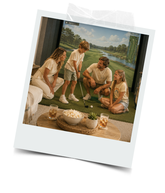 Four family members, including two children and two adults, playing golf indoors with a golf green backdrop, snack bowls, and drinks on a coffee table.
