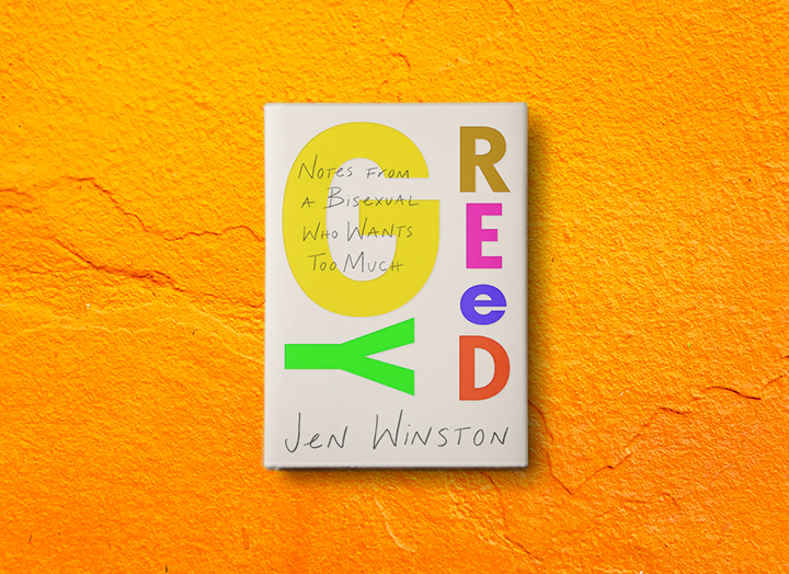 Book titled "Rey" with colorful letters and handwritten notes on the cover, hanging against an orange textured wall.