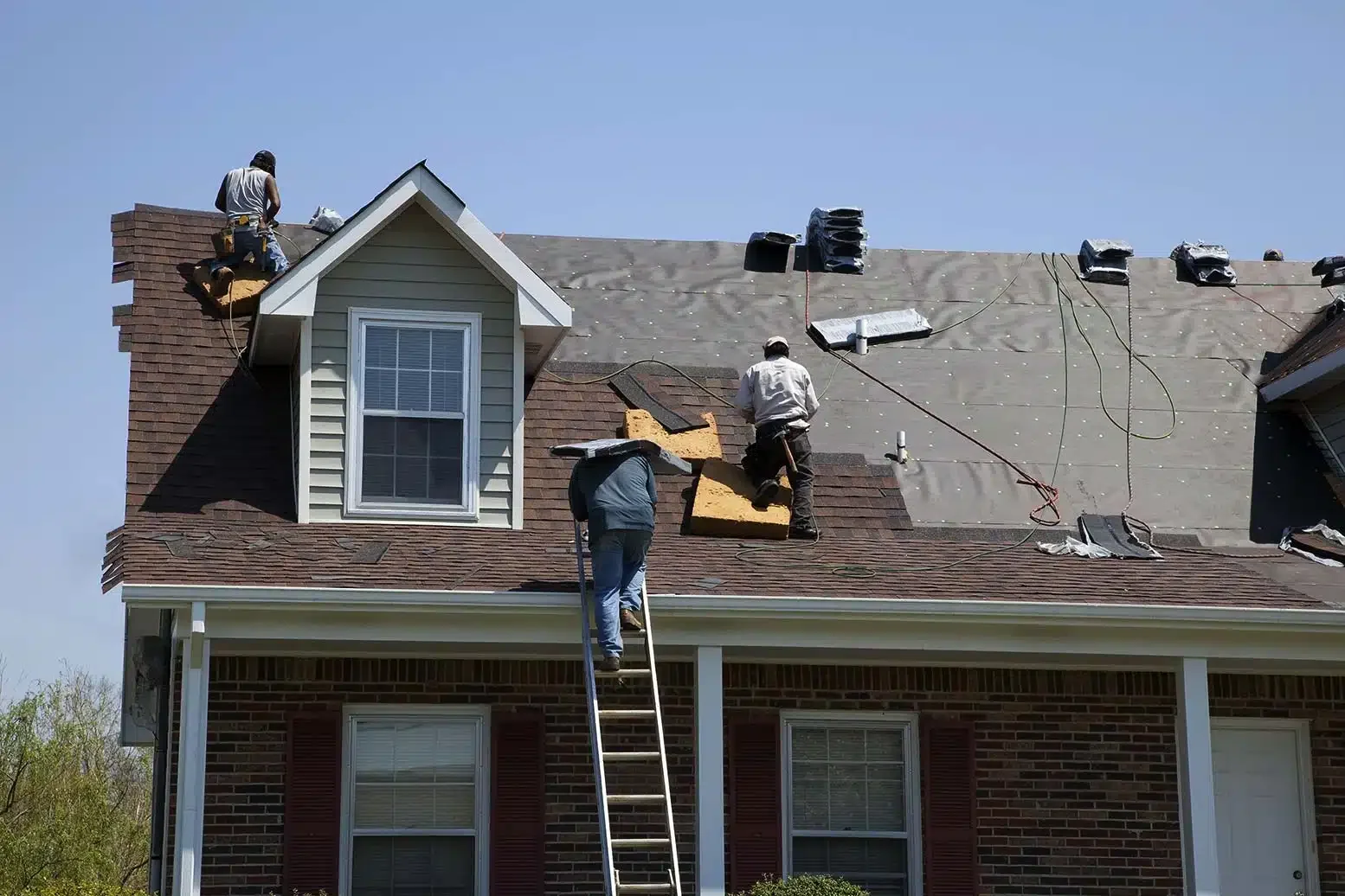 Roof-repair-in-denver-roofers-fixing-roof-after-a-storm.webp