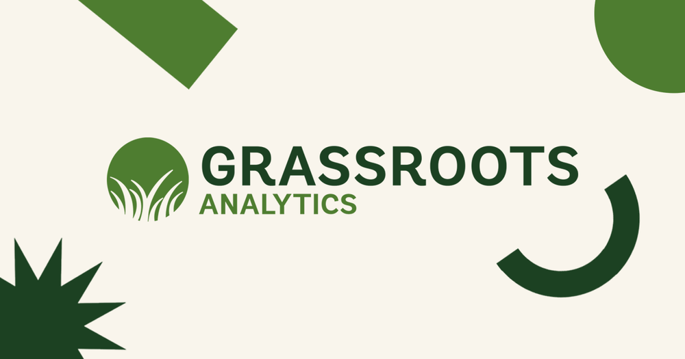 Grassroots Analytics logo with green shapes around the text on a beige background.