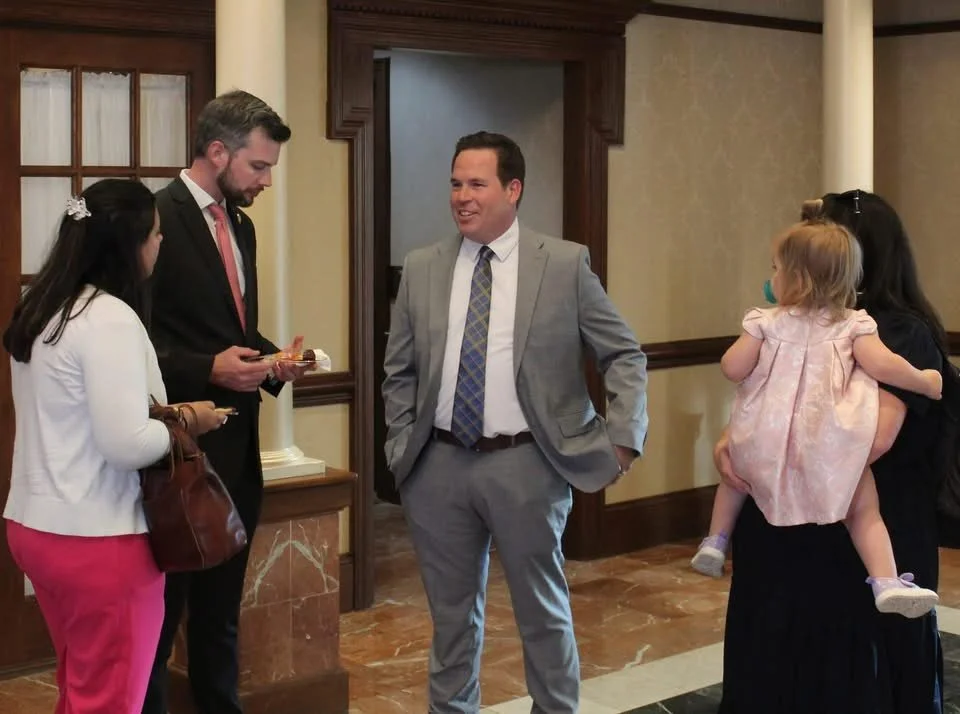 Group of people talking in a room.