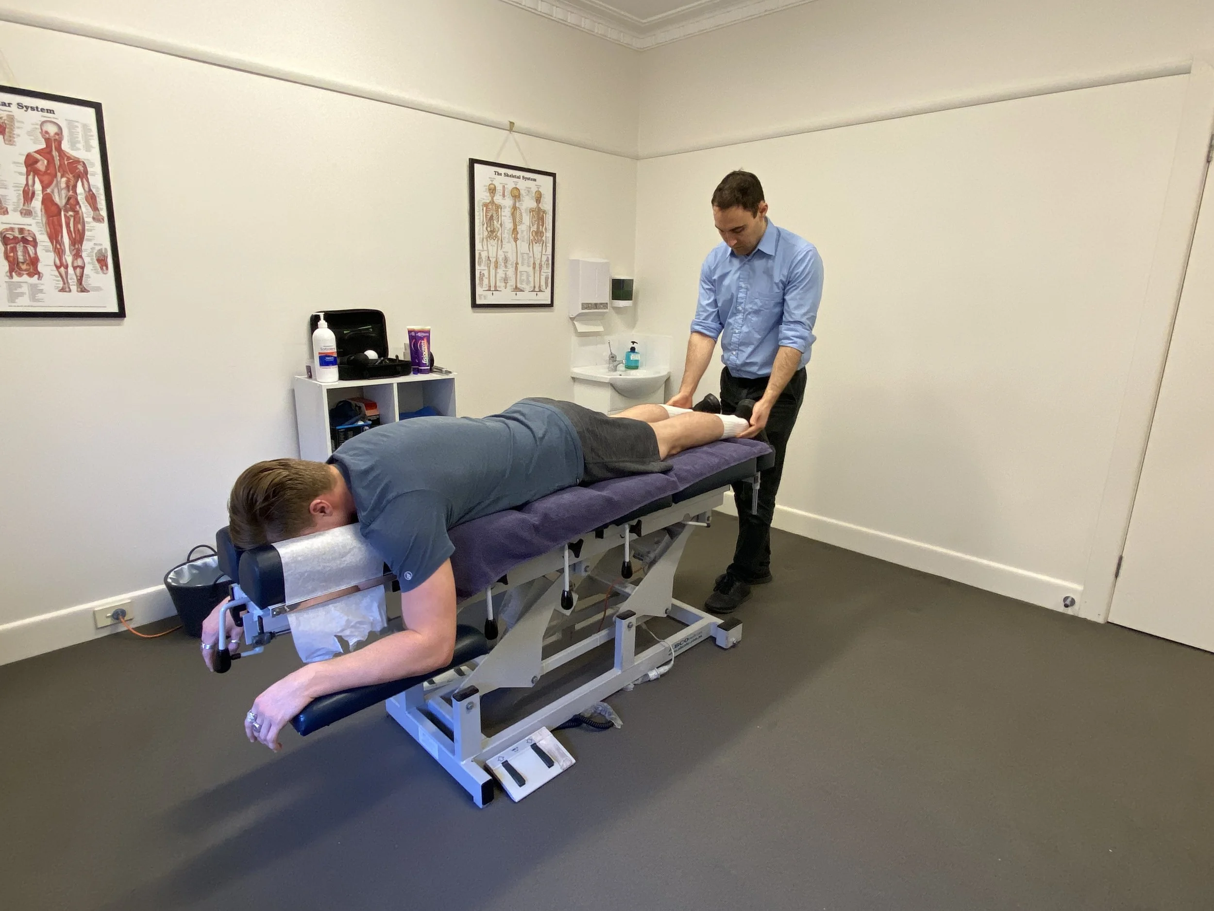A man receiving a leg massage from Sports Osteopath Dr David Cork a therapist in Active Health Performance Hub Bentleigh  East