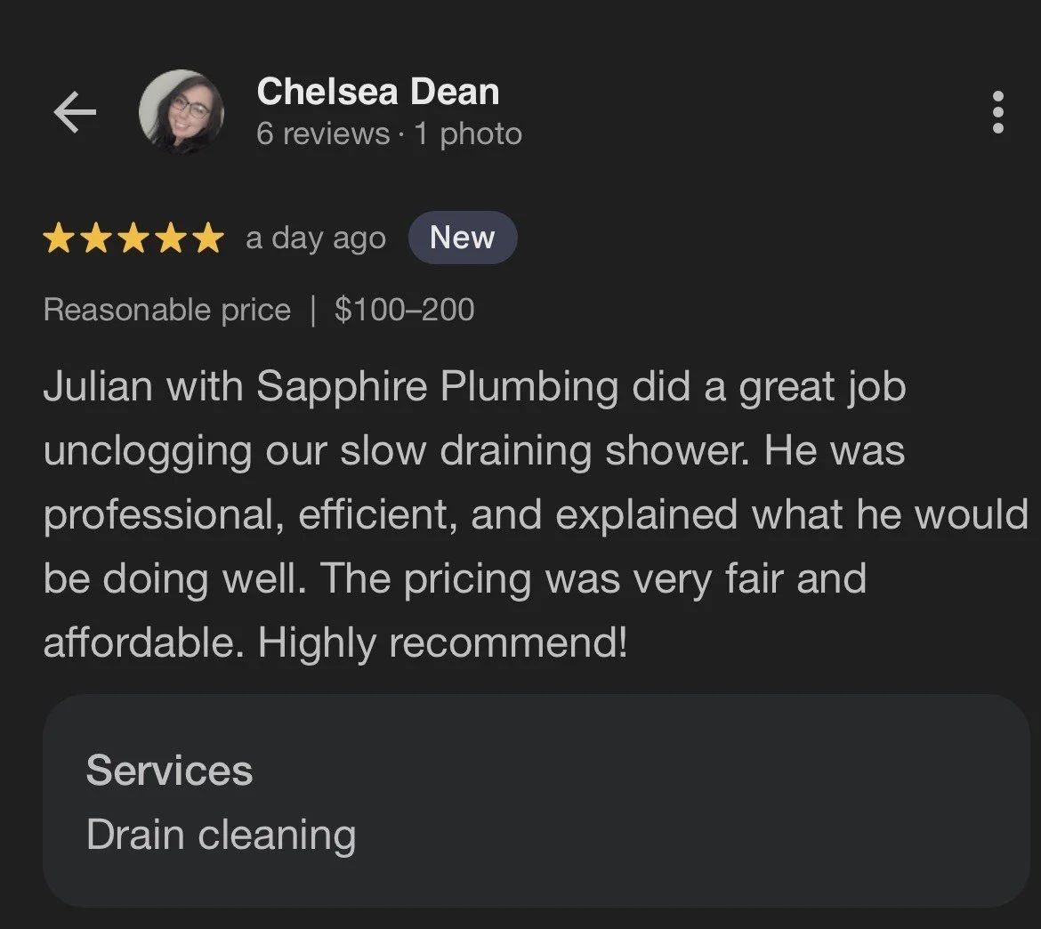 Screenshot of a Google review for Sapphire Plumbing by Chelsea Dean, giving a five-star rating and praising Julian for unblocking a slow draining shower, mentioning professionalism, efficiency, and affordability.