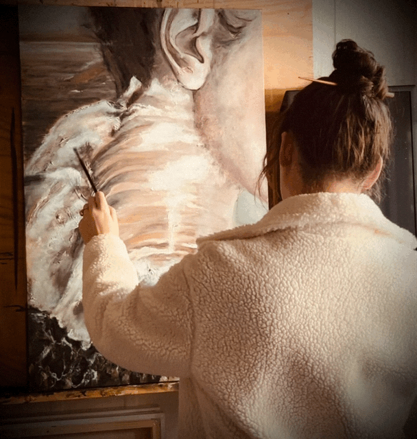 Artist at work in her studio.