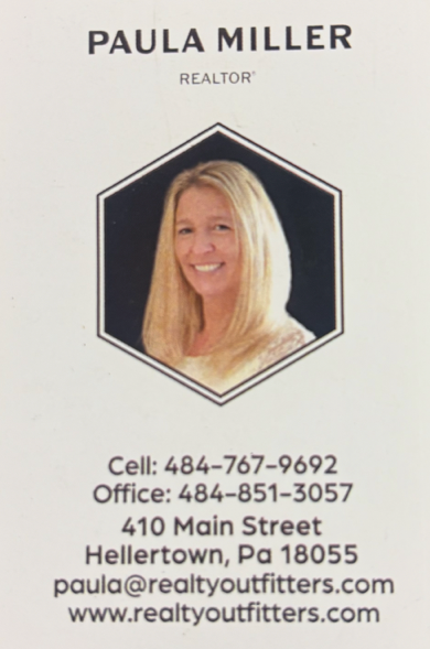 Business card for Paula Miller, a realtor. The card features a photo of Paula smiling with long blonde hair inside a hexagon. Contact details include cell number, office number, address in Hellertown, PA, email, and website.