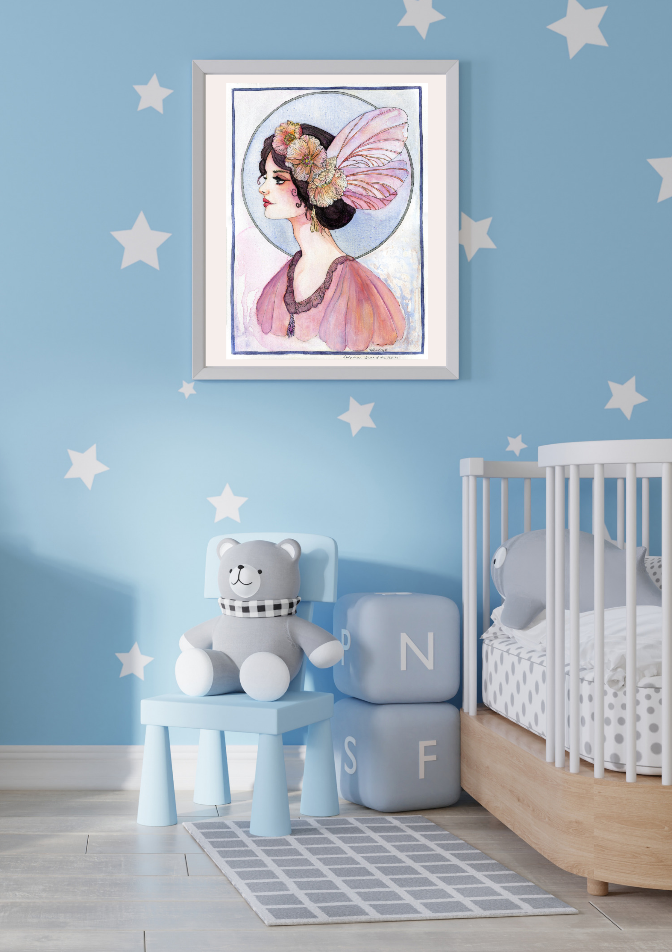 Lady Susan, Queen of the Fairies framed fairy art print hanging in a soft blue children's nursery with a cot and teddy bear