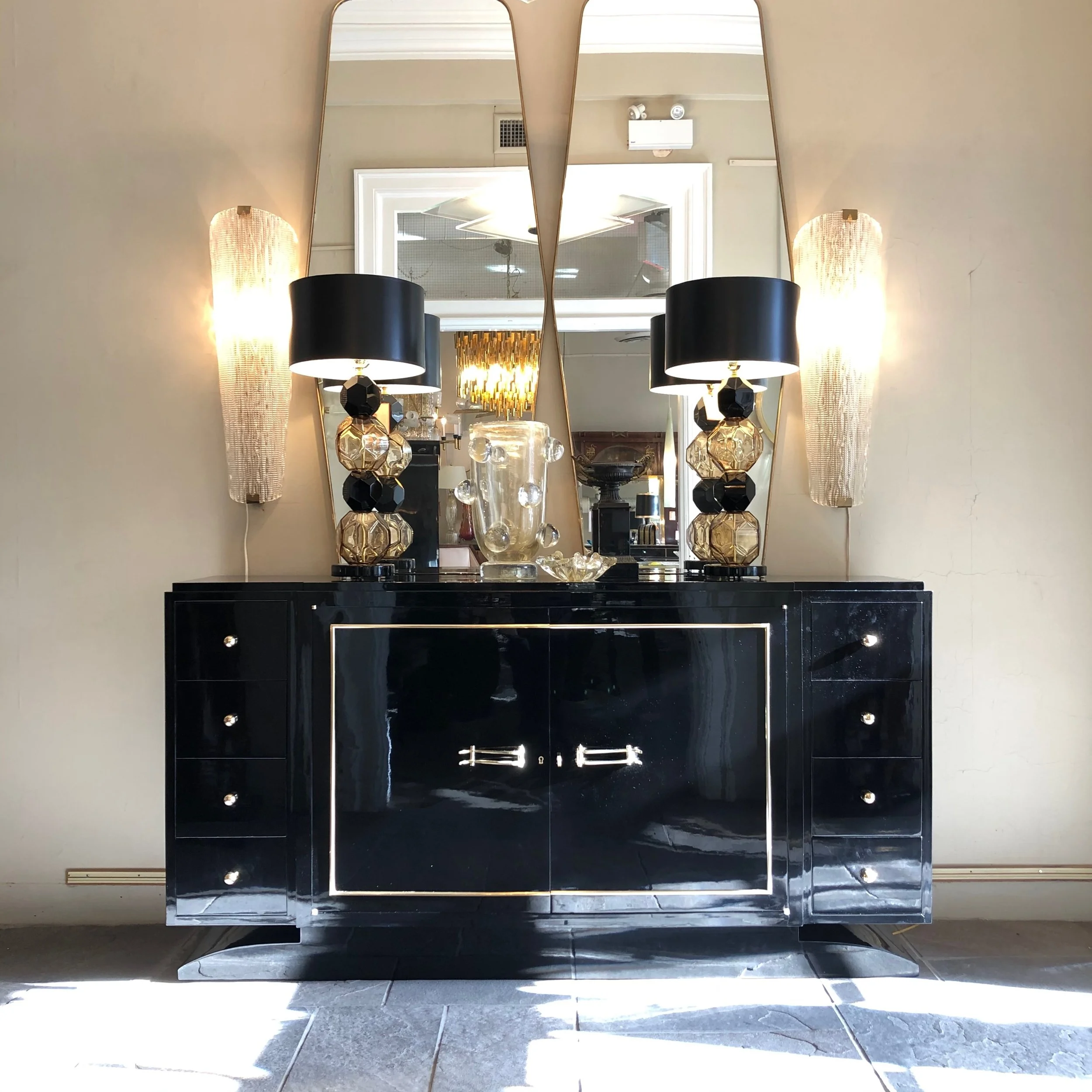 Shane Arron Design displayed this hallway with an Impressive Black buffet from France and two Murano Glass Black and Amber rare lamps that even 1stdibs buyers could not find.  Shane Aaron Design is the specialty European Commercial fixture cleaner.